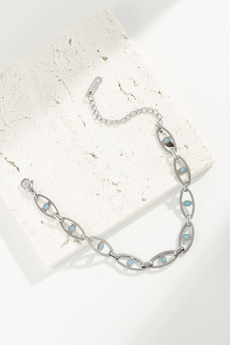 Ward off bad vibes with this sleek and stylish SS HOLLOW EYE BRACELET! The stainless steel evil eye design not only looks cool but also makes this bracelet hypoallergenic and tarnish resistant. Keep your look up and your worries down with this trendy accessory.