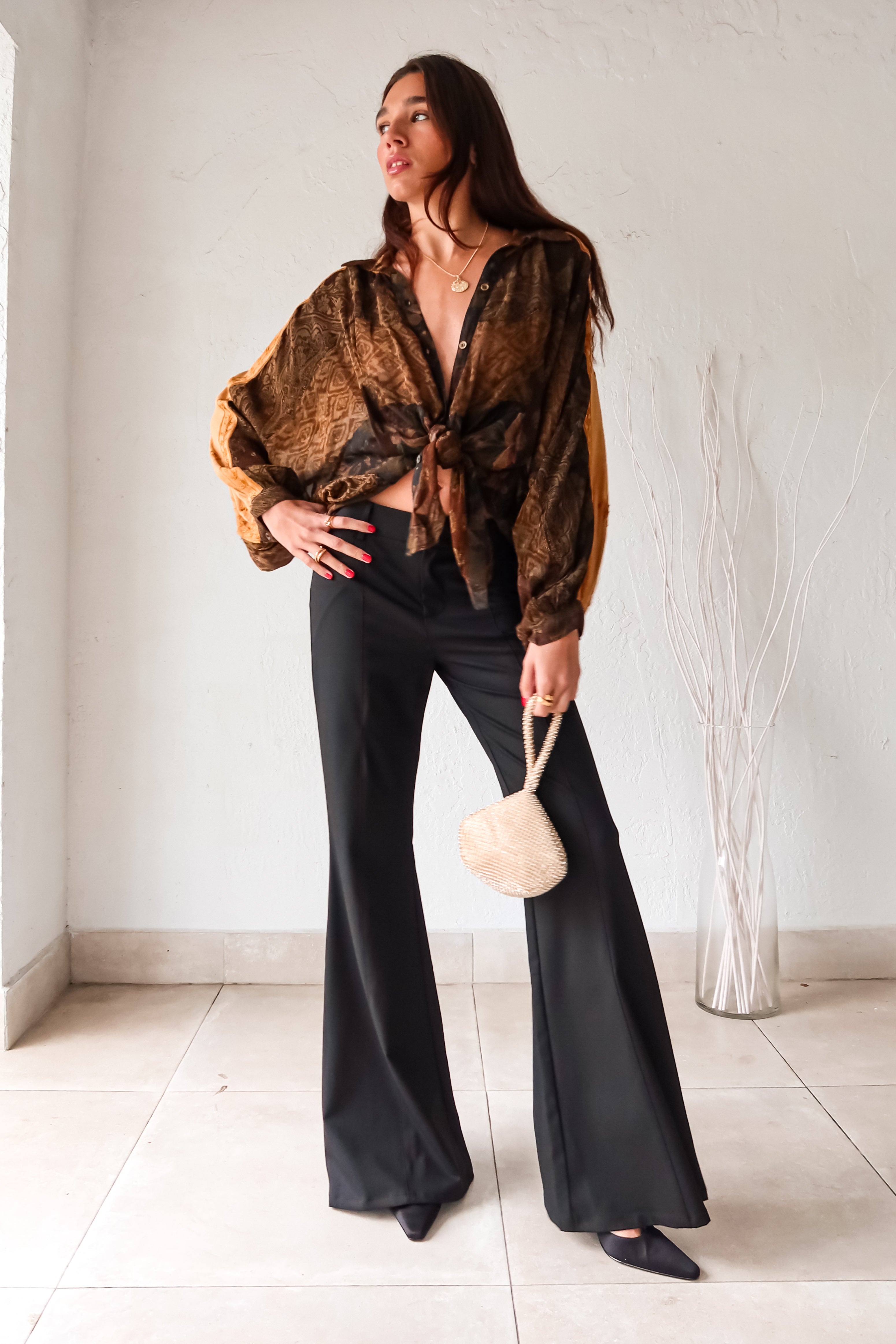 Don't work it, WORK IT in these black trousers! With a pleated front, belt loops, clip zipper closure, and front pockets, these trousers mean business. Say goodbye to boring work pants and hello to sleek and stylish office attire.