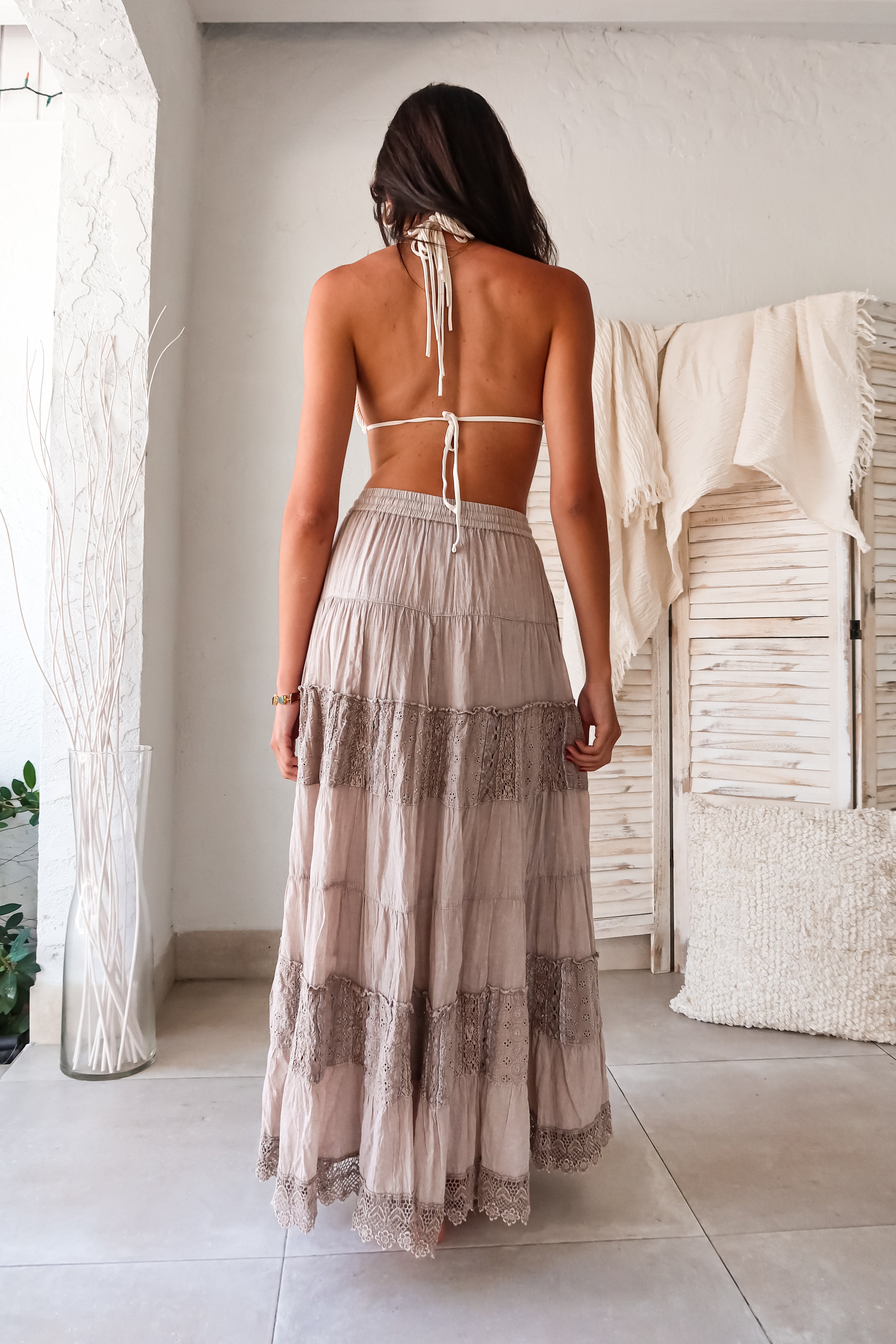 Dazzle on the beach with our CRINKLE LUREX STRING BIKINI SET. The lurex crinkle fabric creates a shimmering effect while the adjustable sliding triangle top, gold bead detailing, and string hang add a touch of playfulness. The moderate cut bottoms feature side ties for a comfortable fit.