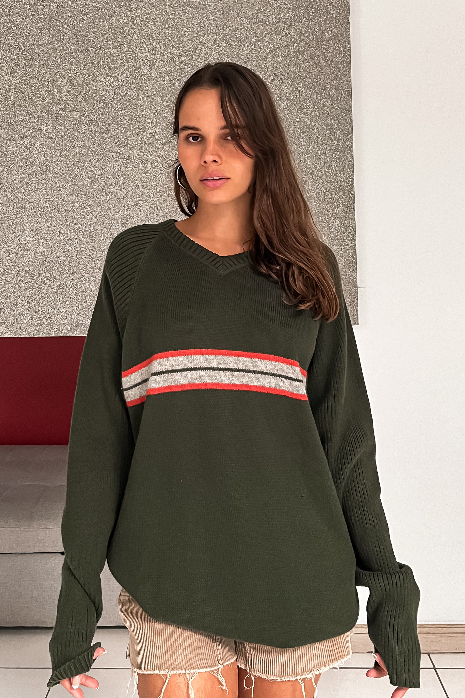 Introducing the CANES CLASSROOM VINTAGE SWEATER! This Tommy Hilfiger 90's V neck sweater features a comfortable stretchy fabric for a good oversize fit. Made with 100% cotton, and the Hilfiger label intact, this vintage piece fits sizes S-L. Stay warm this semester, Miami AC's are very cold!