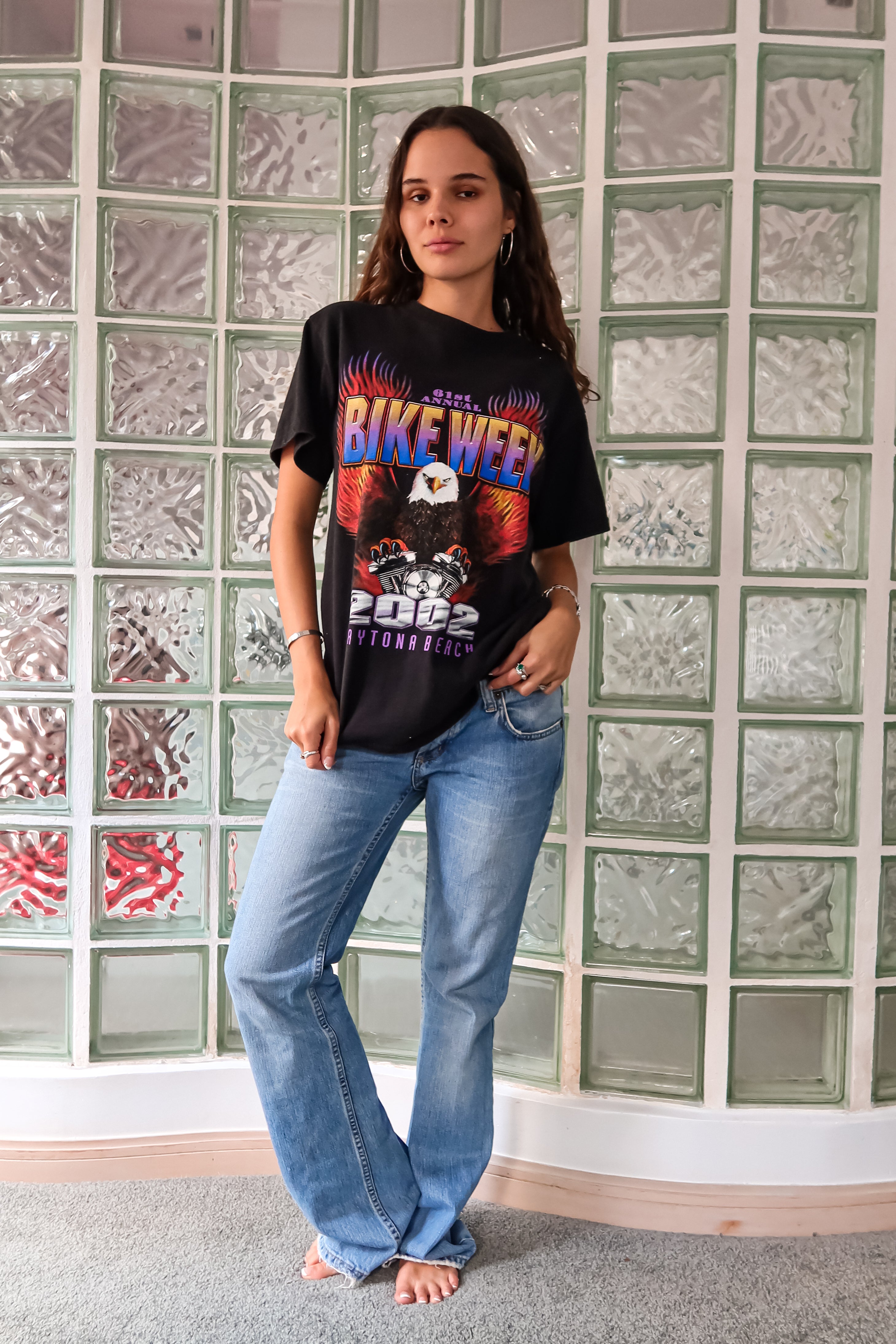 Get ready to hit the streets in style with our BIKE WEEK DAYTONA 2002 VINTAGE TEE! This one-of-a-kind t-shirt features a unique black design for both the front and back, made from 100% cotton for a comfortable fit. Perfect for sizes S-L, this tee is sure to add some vintage flair to your wardrobe.