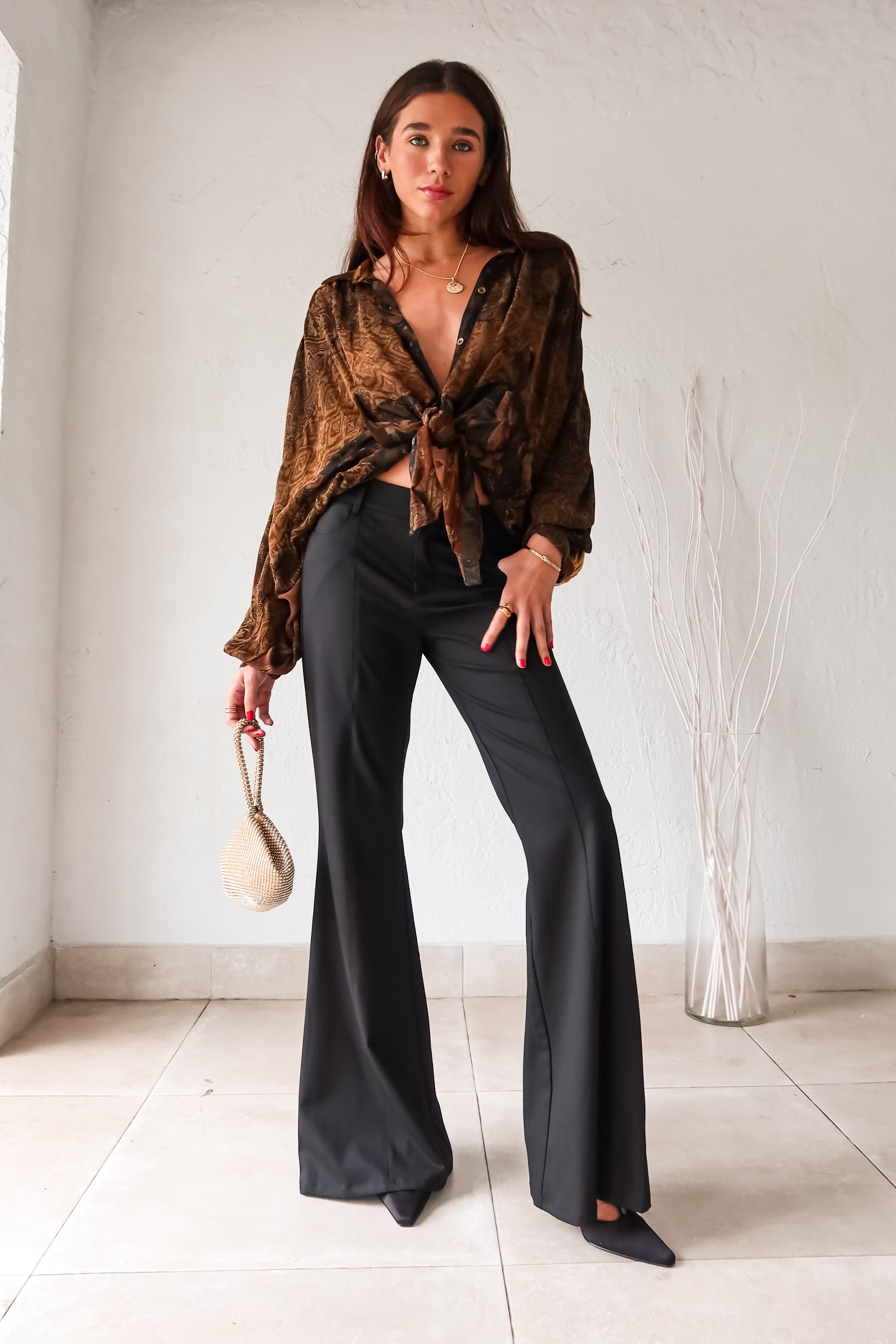 Don't work it, WORK IT in these black trousers! With a pleated front, belt loops, clip zipper closure, and front pockets, these trousers mean business. Say goodbye to boring work pants and hello to sleek and stylish office attire.