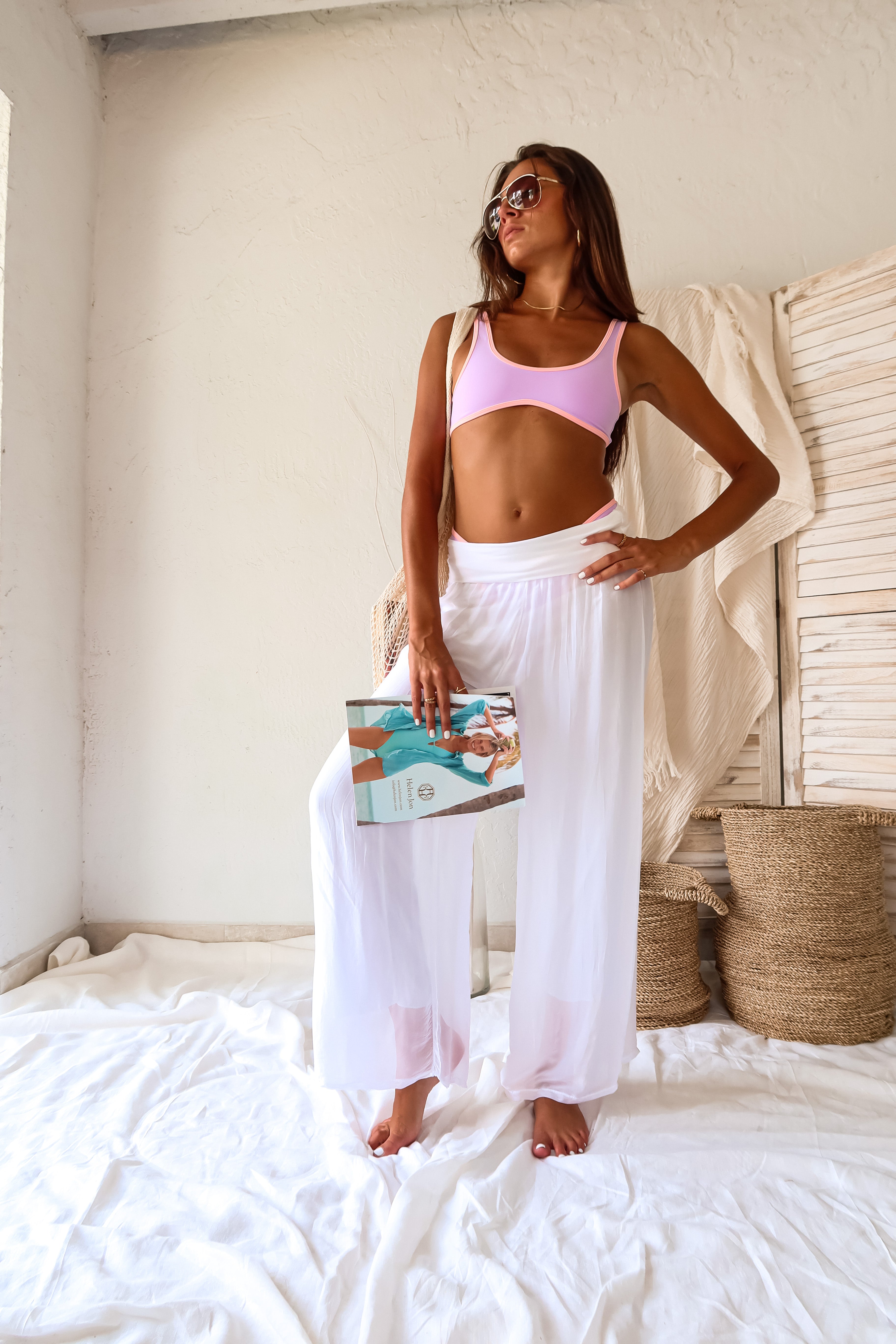 Get ready to strut your stuff in our VIBE SPORT BIKINI SET! This sporty set features a pink and lilac color scheme with a stylish lilac base and baby pink piping. The bra style top provides support while the high leg California cut bottoms offer a perfect balance between skimpy and moderate coverage. Made in Italy for the ultimate quality. Bring on the beach vibes!