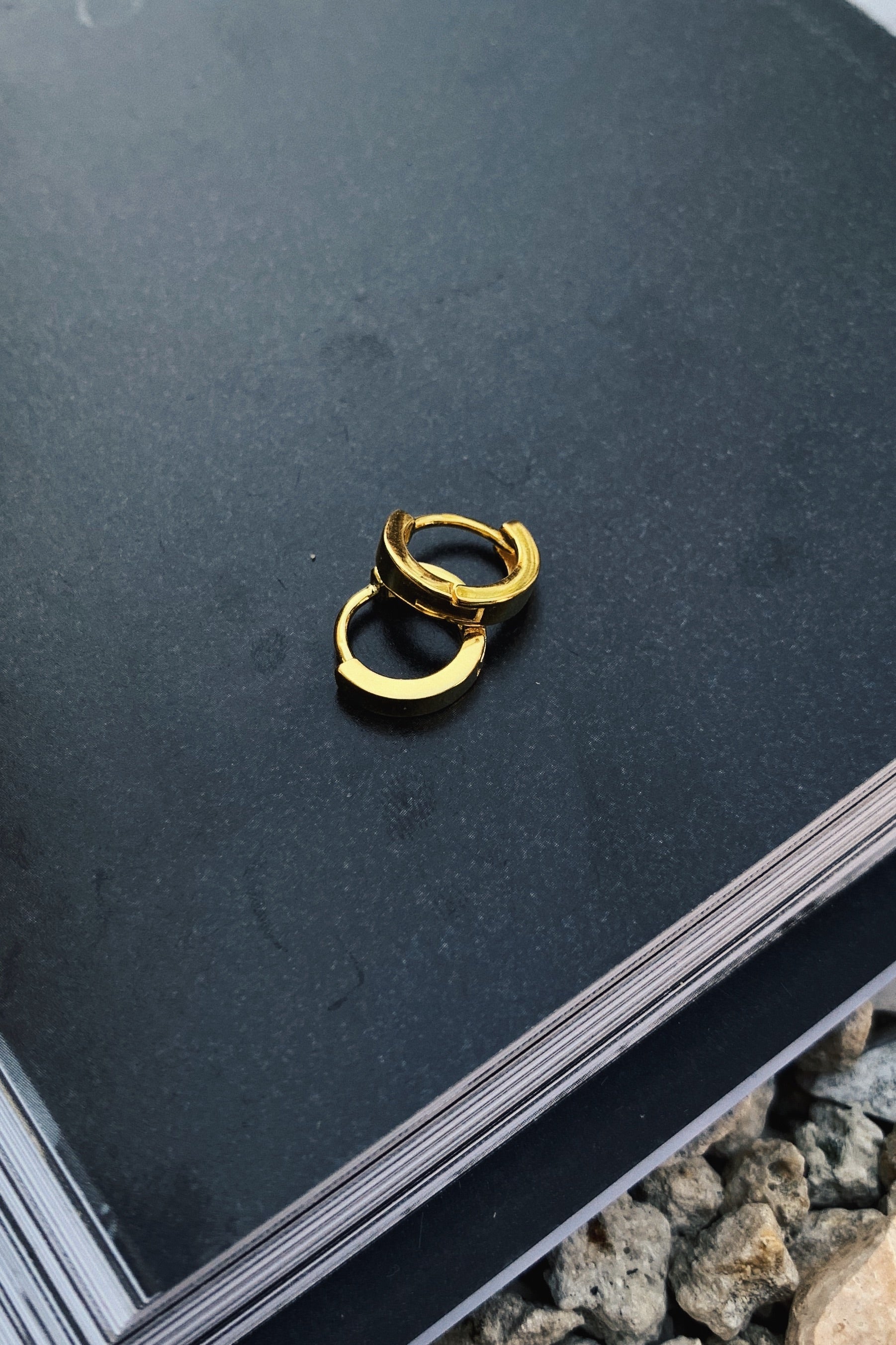 Add some glamour without the irritation! GP HOOP HUGGIES are hypoallergenic and perfect for sensitive ears. Made with gold plated 925 sterling silver, these mini hoops will elevate any look.