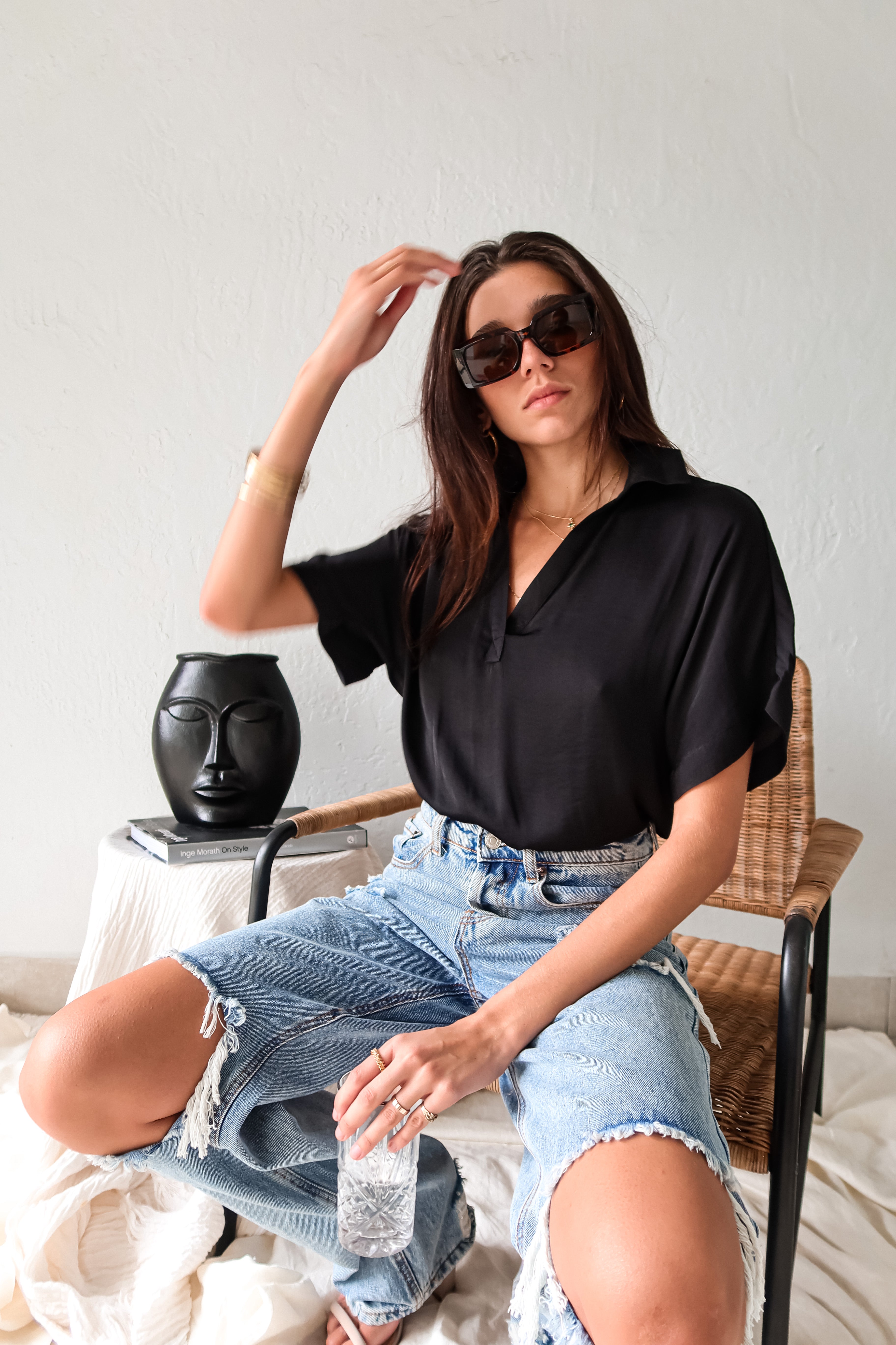 DOWNTOWN BLOUSE in classic black is a best seller for a reason. With a v-neck collared design and lightweight satin feel, this top is effortlessly chic. The cuffed sleeve adds a touch of sophistication