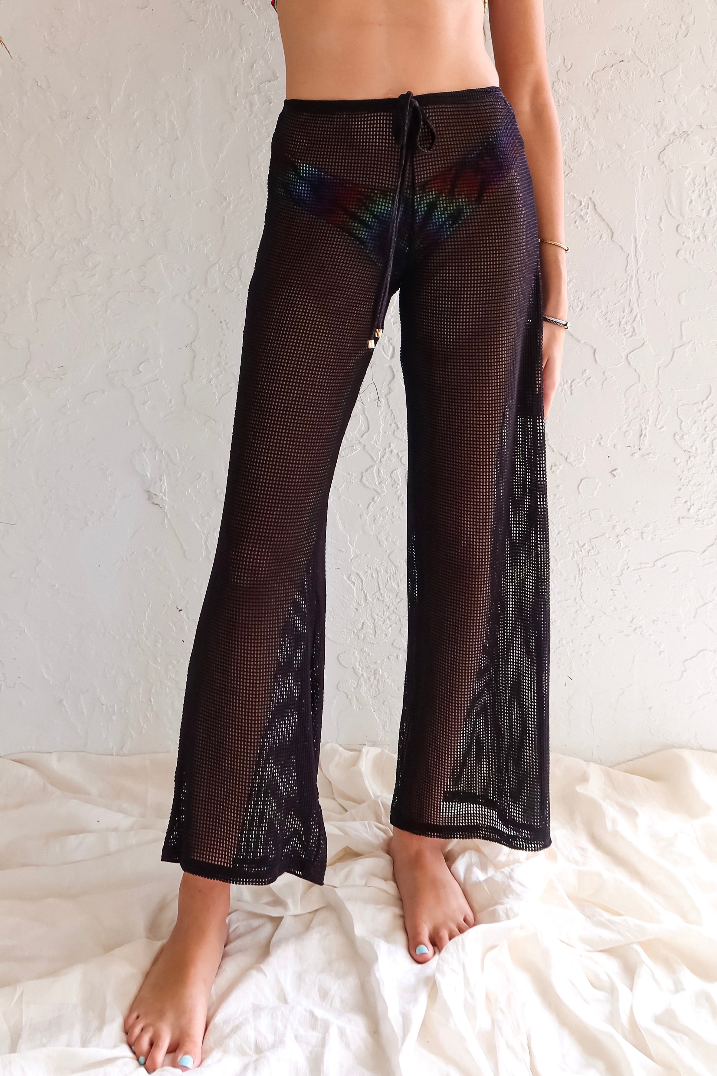 Your new best friend at the beach and poolside! Our Sasha mesh pant has been a constant best seller for the past 5 years and for good reason. This snag-proof sheer stretch mesh design is not only durable and water-friendly, but also quick-drying for all your aquatic adventures. With an elastic waistband and faux drawstring, you'll be the envy of the pool (or beach)!