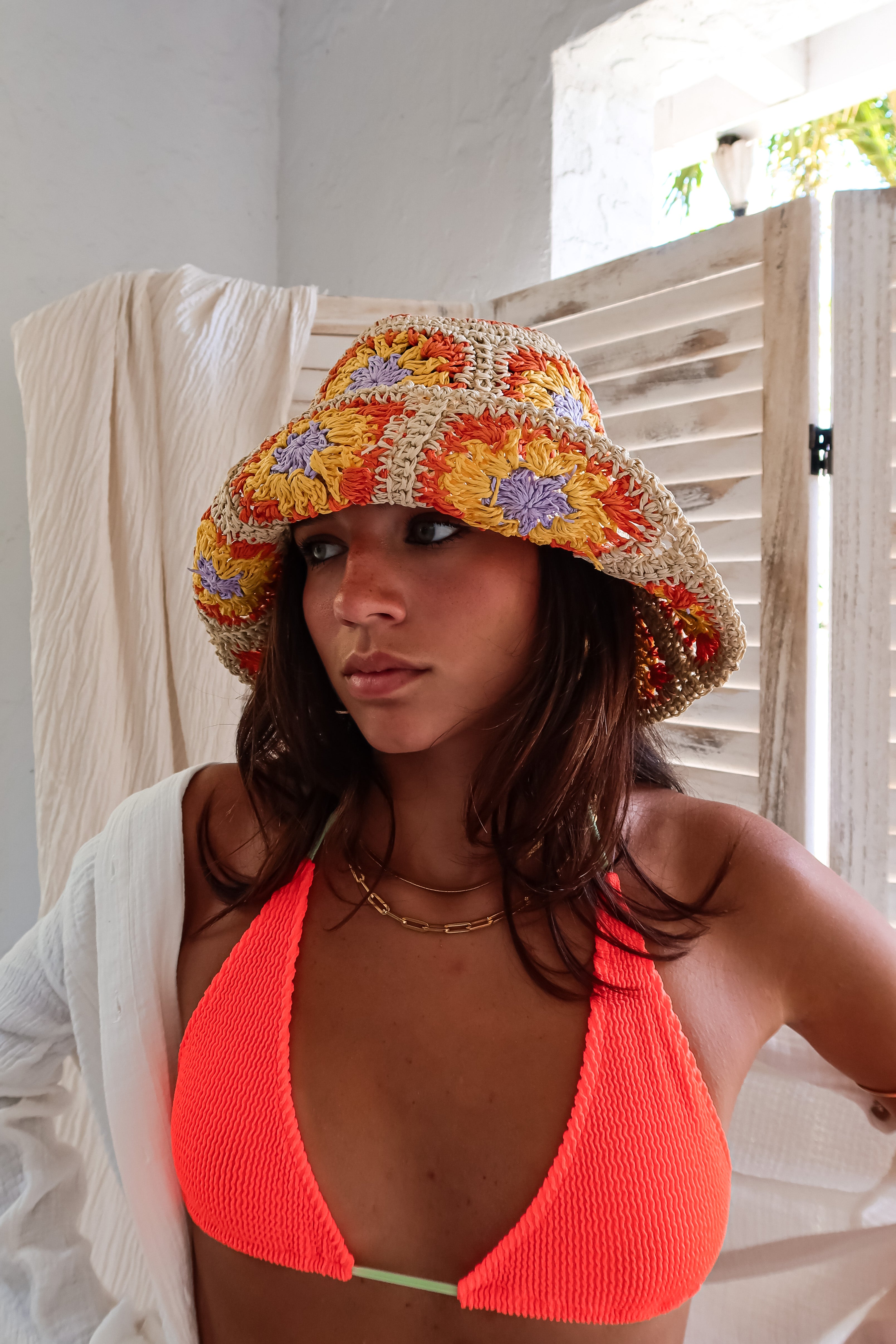 Get ready to make a splash in our OCEANSIDE ONE SIZE BIKINI! This smocked hot orange two-piece will have you standing out on the beach. With a sliding triangle adjustable top and high leg Brazilian coverage bottom, you can customize your fit for maximum comfort. Green tie detailing adds a fun pop of color. And don't worry about sizing - this bikini fits all (XS-XL)! Hand wash cold and show off your style, made in Miami by Alila Swim.