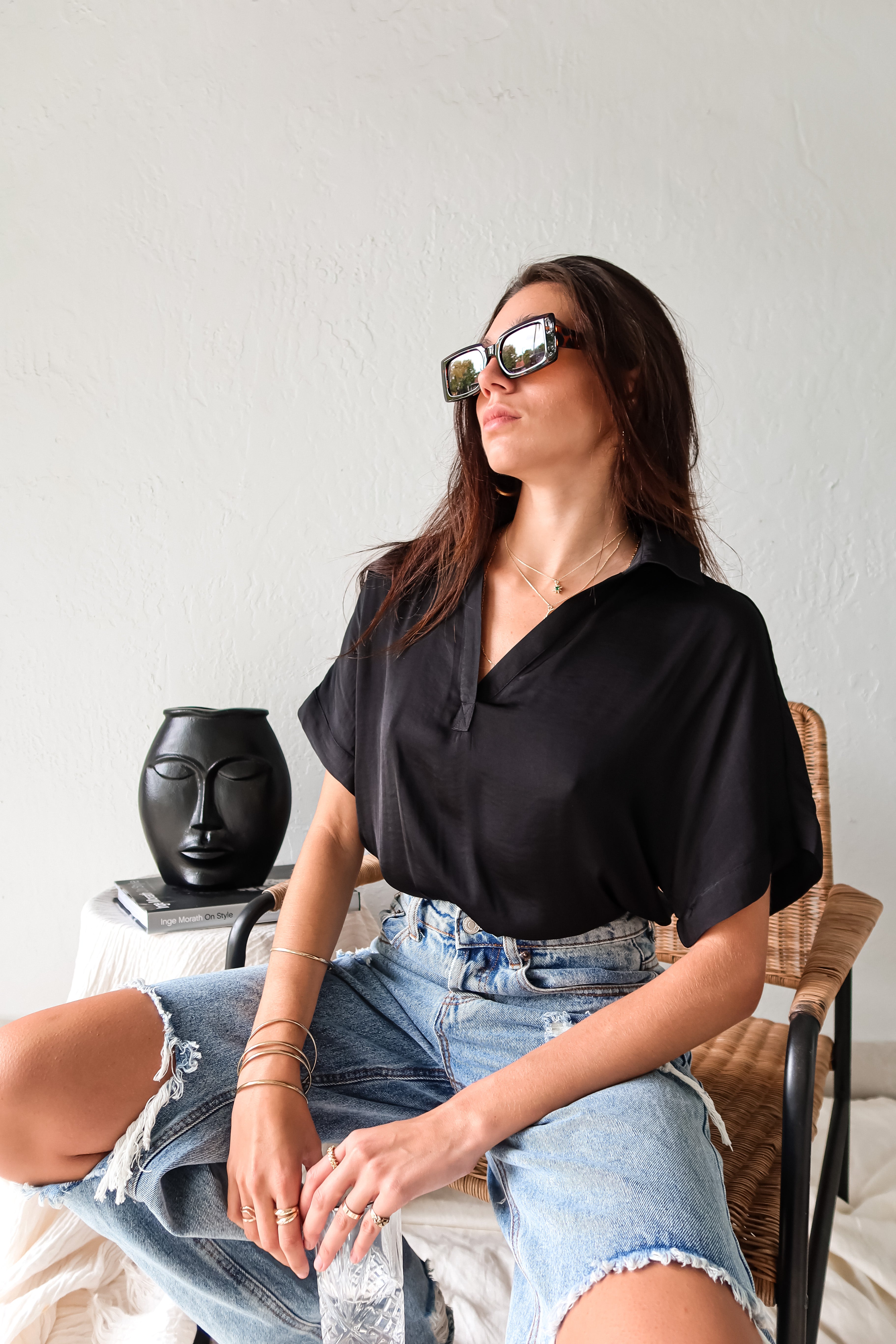 DOWNTOWN BLOUSE in classic black is a best seller for a reason. With a v-neck collared design and lightweight satin feel, this top is effortlessly chic. The cuffed sleeve adds a touch of sophistication