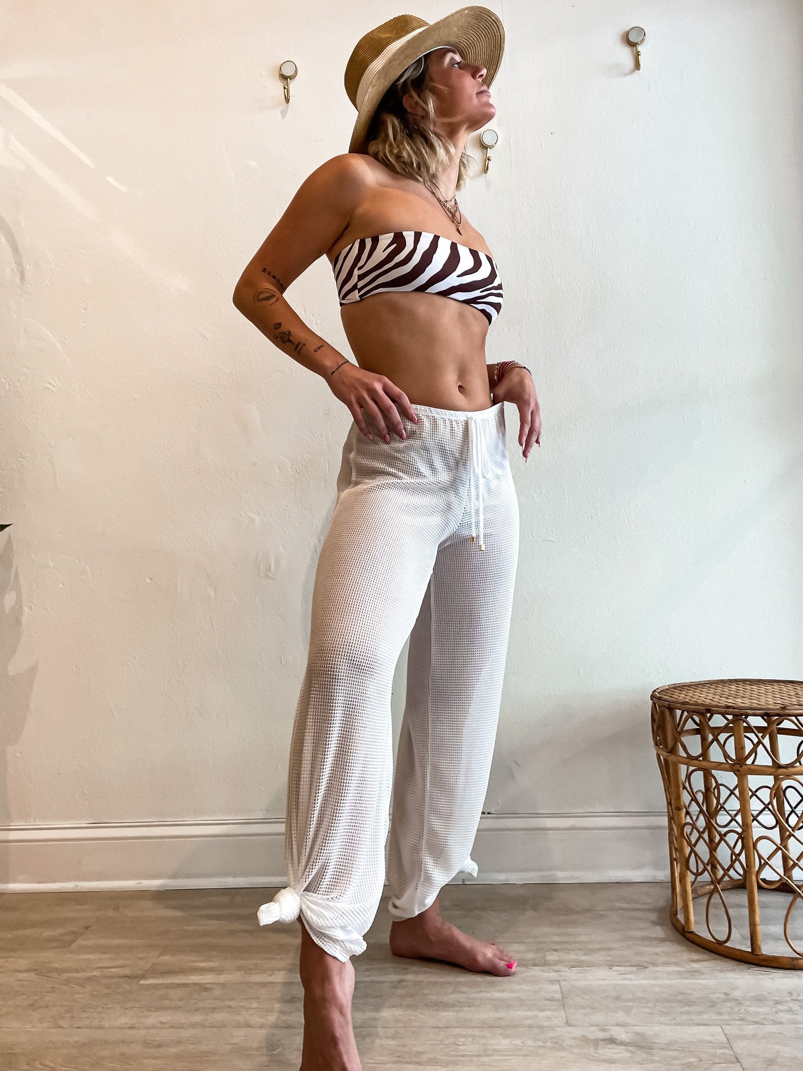 Your new best friend at the beach and poolside! Our Sasha mesh pant has been a constant best seller for the past 5 years and for good reason. This snag-proof sheer stretch mesh design is not only durable and water-friendly, but also quick-drying for all your aquatic adventures. With an elastic waistband and faux drawstring, you'll be the envy of the pool (or beach)!