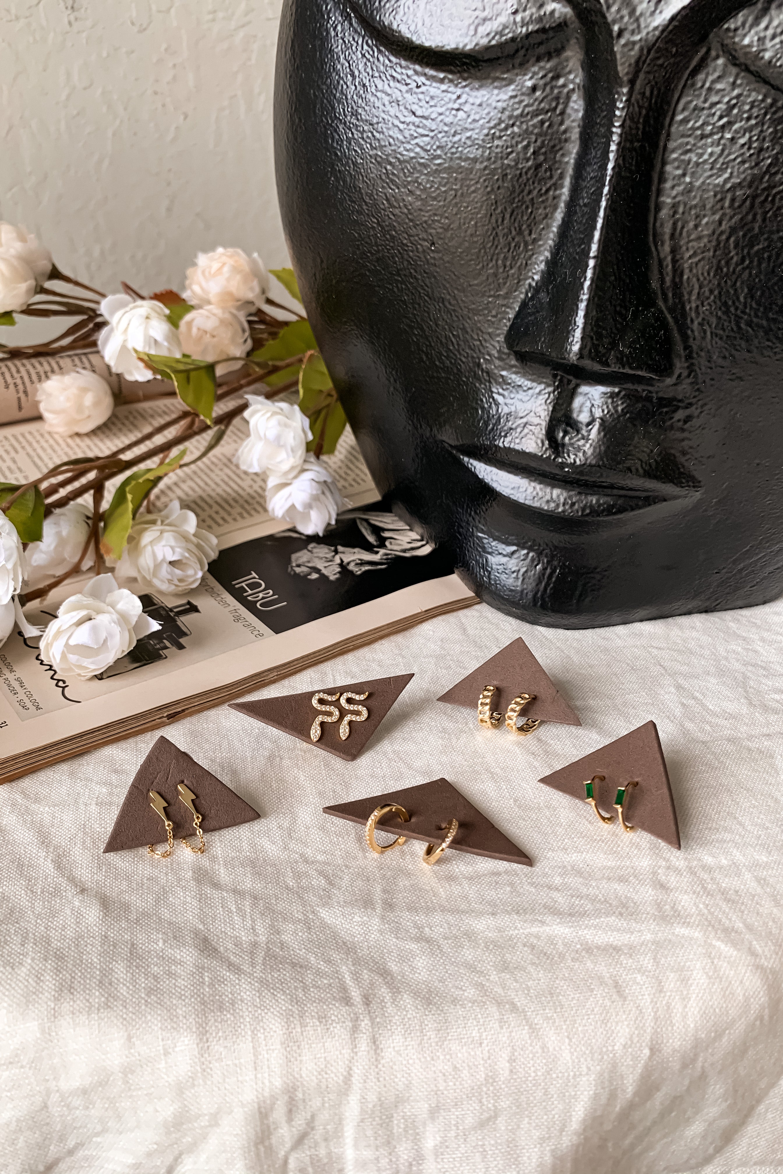 Add a touch of glam with these pave huggie earrings. Gold plated over sterling silver, these hoops offer a secure wire closure and 2 cm length. Perfect for everyday wear (and showing off!).