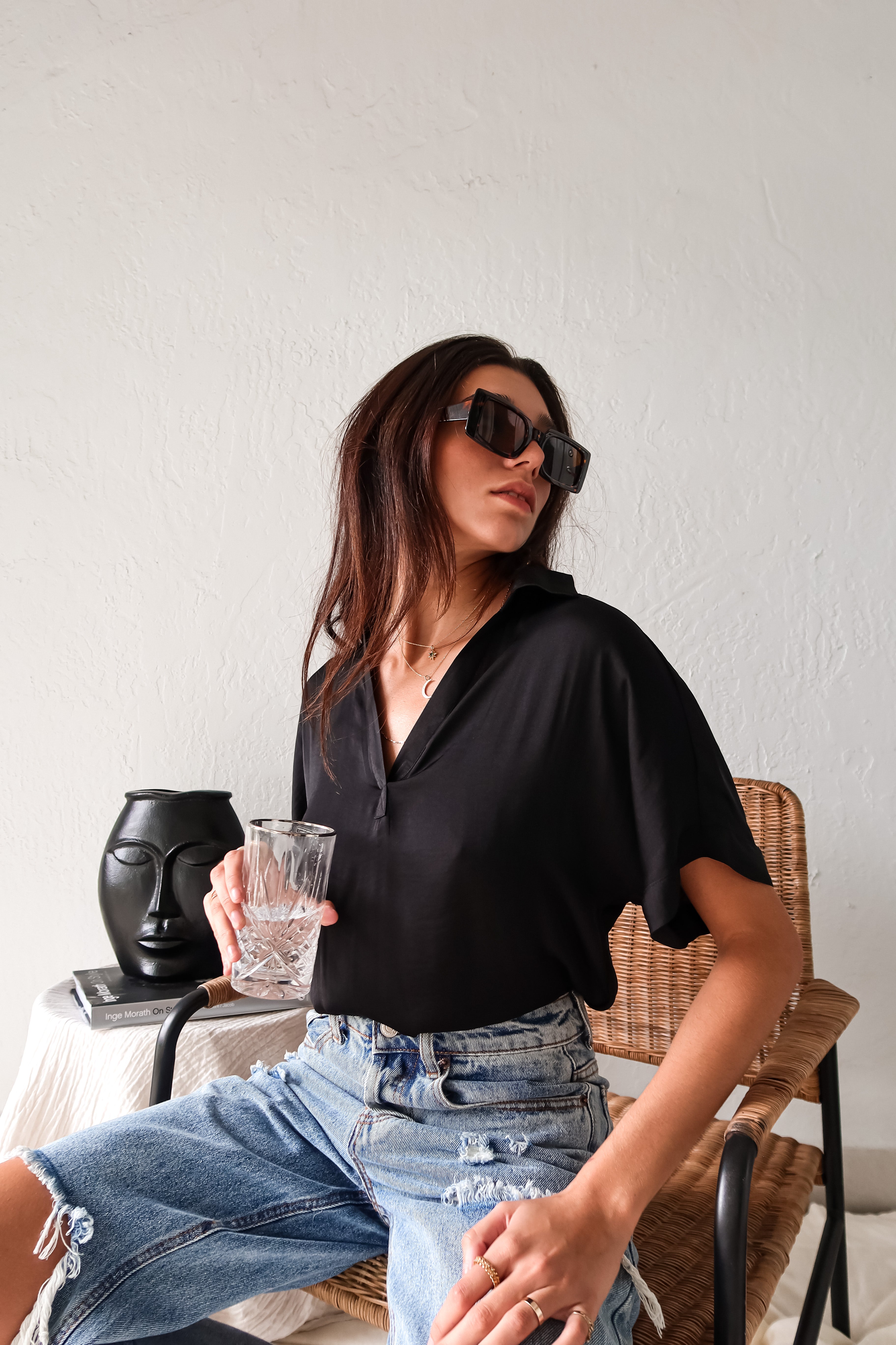 DOWNTOWN BLOUSE in classic black is a best seller for a reason. With a v-neck collared design and lightweight satin feel, this top is effortlessly chic. The cuffed sleeve adds a touch of sophistication