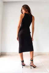 Turn heads in the YOKO RIBBED MIDI DRESS. This black ribbed dress features a playful left leg slit and stretchy fabric for a comfortable fit. Perfect for any occasion, this dress will have you looking effortlessly stylish and feeling confident!