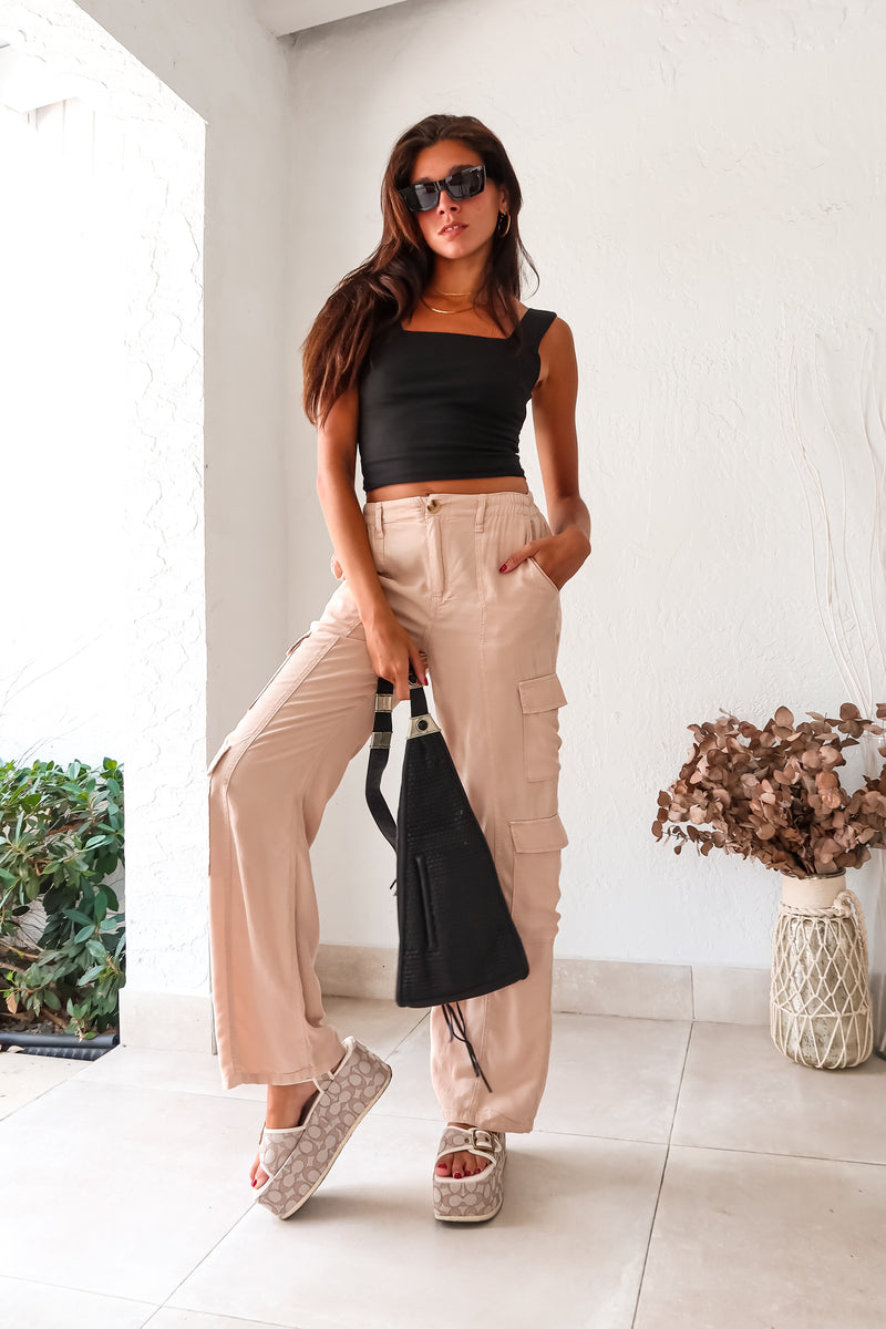 Be weekend-ready with these khaki tencil cargo pants. The button zipper closure, stretchy waist band, and multiple pockets make them both stylish and comfortable. Add a touch of edginess to your wardrobe with the double side cargo pockets.