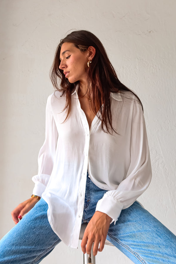 Put a playful twist on your classic work attire with our GABLES LONG SLEEVE BLOUSE. This white, non-lined button down blouse is both lightweight and comfortable for all-day wear. With long sleeves and button wrists, this blouse is perfect for any season. Don't settle for boring office wear, stand out in style!