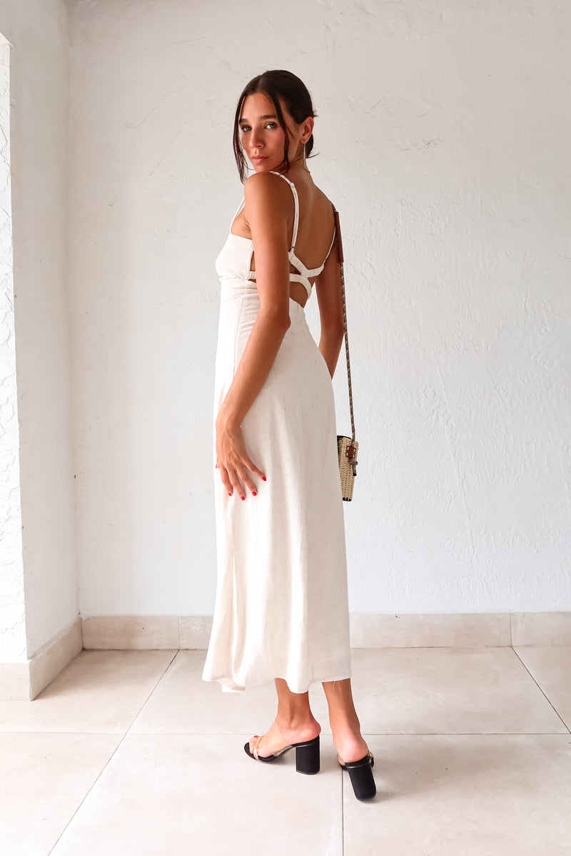 Introducing our MELROSE LINEN MAXI DRESS! This beautiful oatmeal colored dress features adjustable shoulder straps for a perfect fit and a front tie detail for added style. The elastic back straps ensure comfortable wear while the back zipper closure provides easy on and off. Perfect for any occasion!