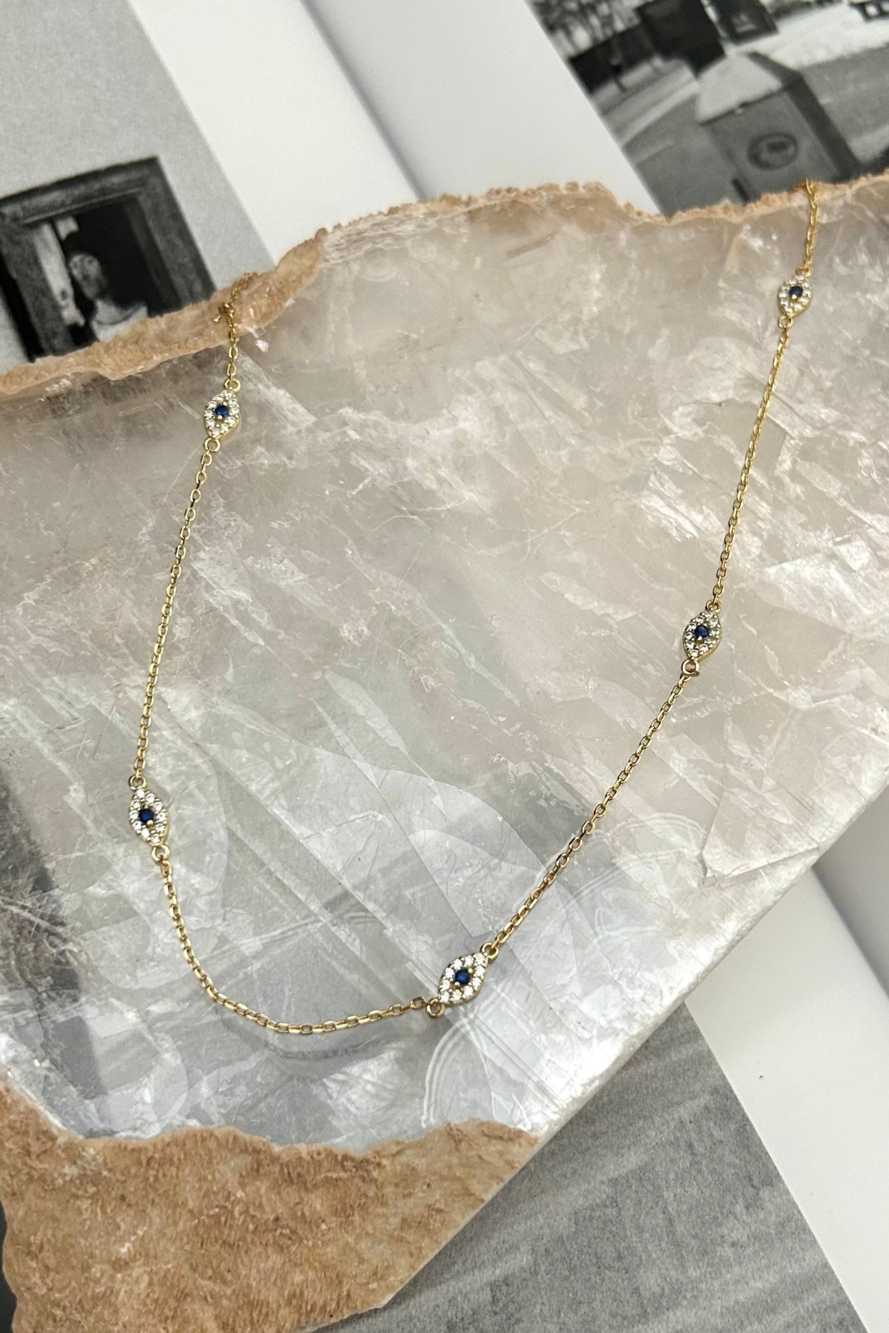 Keep your style on point with our PAVE EYE CHOKER NECKLACE. This stunning piece is crafted with gold plated sterling silver, featuring a dazzling pave eye detail. Plus, it's tarnish resistant and hypoallergenic for worry-free wear. Upgrade your look with this must-have accessory!