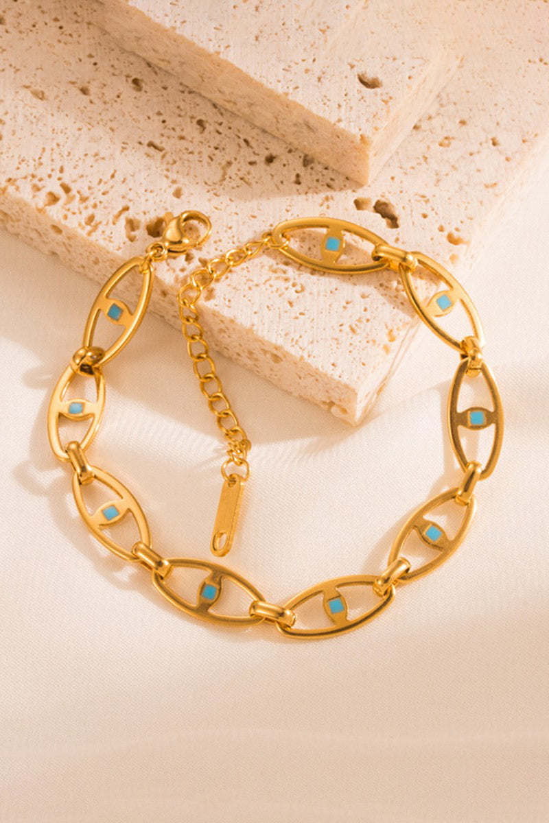 Make a statement with our SS HOLLOW EYE BRACELET - GOLD. This stainless steel bracelet features an evil eye design that is both eye-catching and protective. With tarnish resistant and hypoallergenic properties, this bracelet is perfect for those with sensitive skin. So be bold and stylish without any worries!