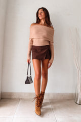 The VESPER MINI SKIRT in brown is the perfect mix of style and comfort. The overlap front detail adds a touch of flair, while the back zipper closure makes it easy to slip on and off. With shorts underneath and stretchy fabric, this mini skirt is both practical and flattering.