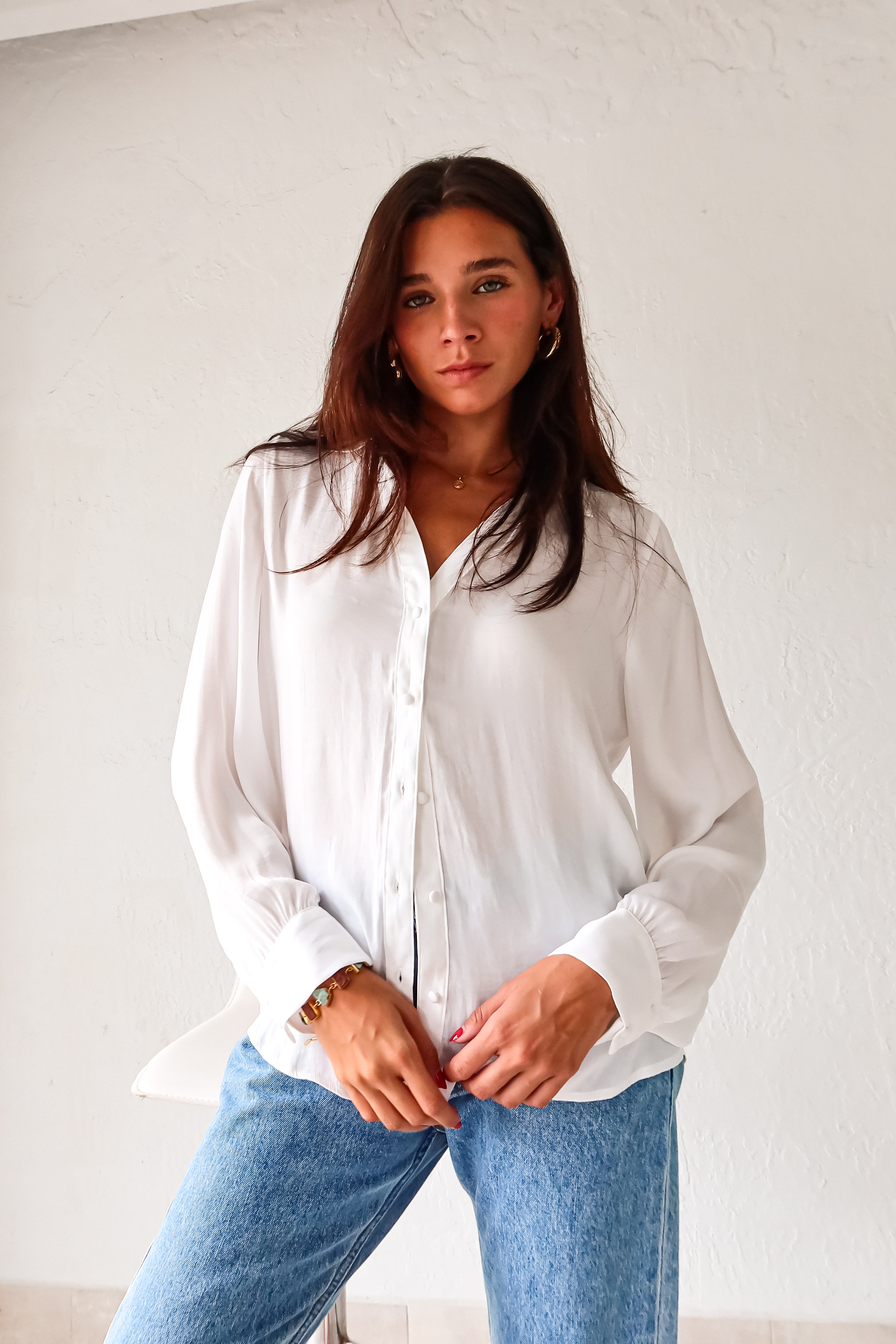 Put a playful twist on your classic work attire with our GABLES LONG SLEEVE BLOUSE. This white, non-lined button down blouse is both lightweight and comfortable for all-day wear. With long sleeves and button wrists, this blouse is perfect for any season. Don't settle for boring office wear, stand out in style!