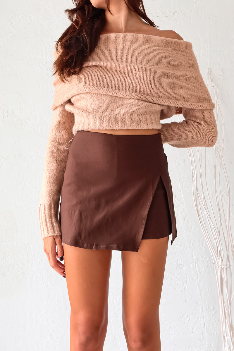 Stay cozy and stylish all season long with our Aspen Sweater! This tan long sleeve sweater features a unique foldover design, ribbed wrist and torso for a snug fit, and stretchy fabric for ultimate comfort. Perfect for any occasion, whether you're out and about or lounging at home.