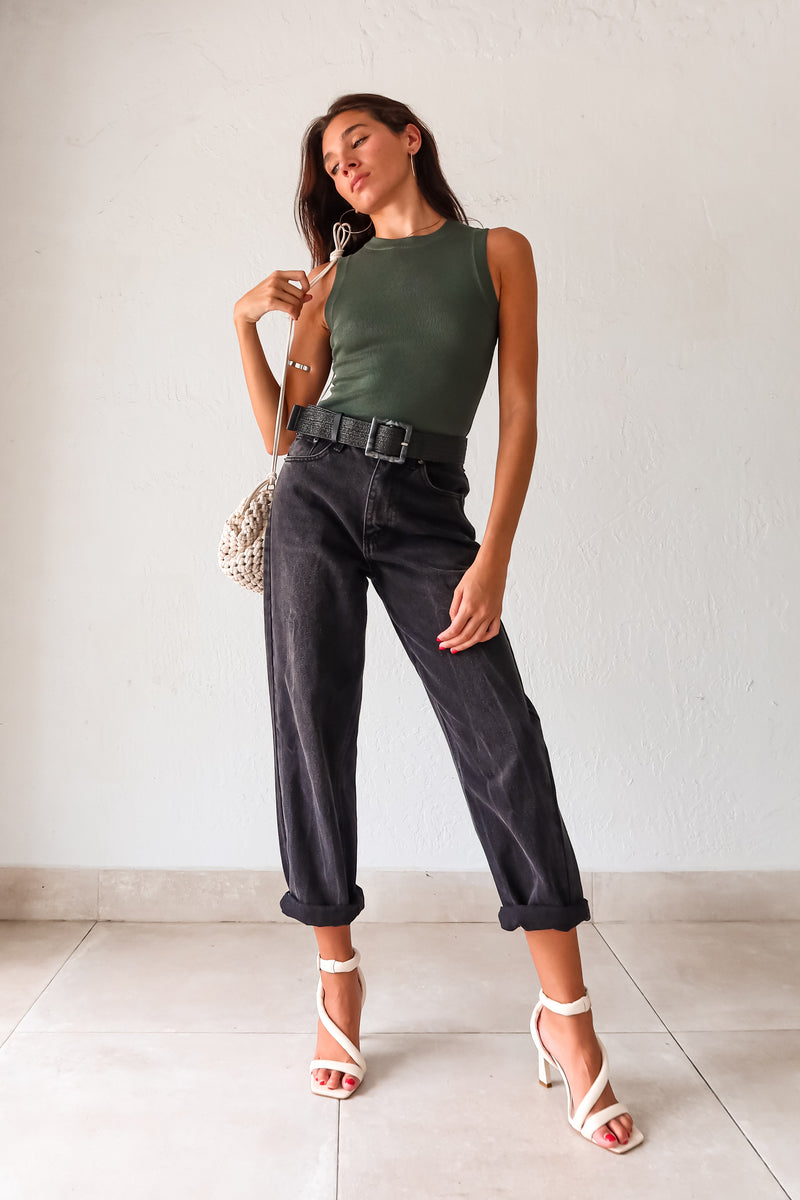 Get ready to elevate your wardrobe with our DRESS IT UP KNIT TANK in hunter green. This ribbed neck tank top is perfect for any occasion and runs big, so size down for the perfect fit. Non-lined and non-stretch, it's easy to care for- just hand wash cold. Pair it with our Marbled Stretch belt and the Grecia Woven Purse for a chic look.