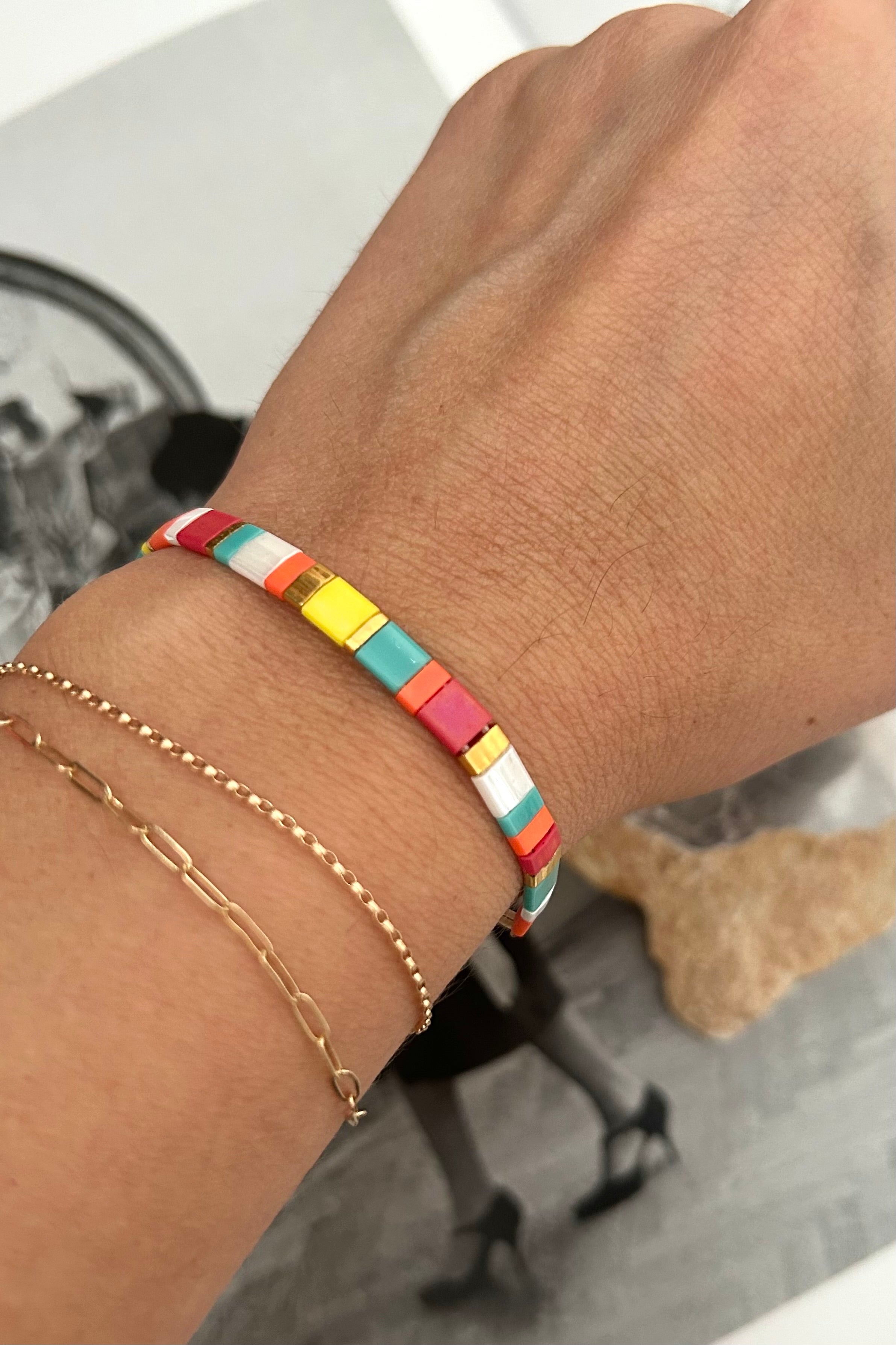 Brighten up any outfit with this playful SD Multi Bracelet! Featuring multi-colored charm rope and boasting tarnish resistance and hypoallergenic properties, this bracelet is perfect for adding a pop of color and style to your look without the worry of discoloration or irritation. Your wrist will thank you!