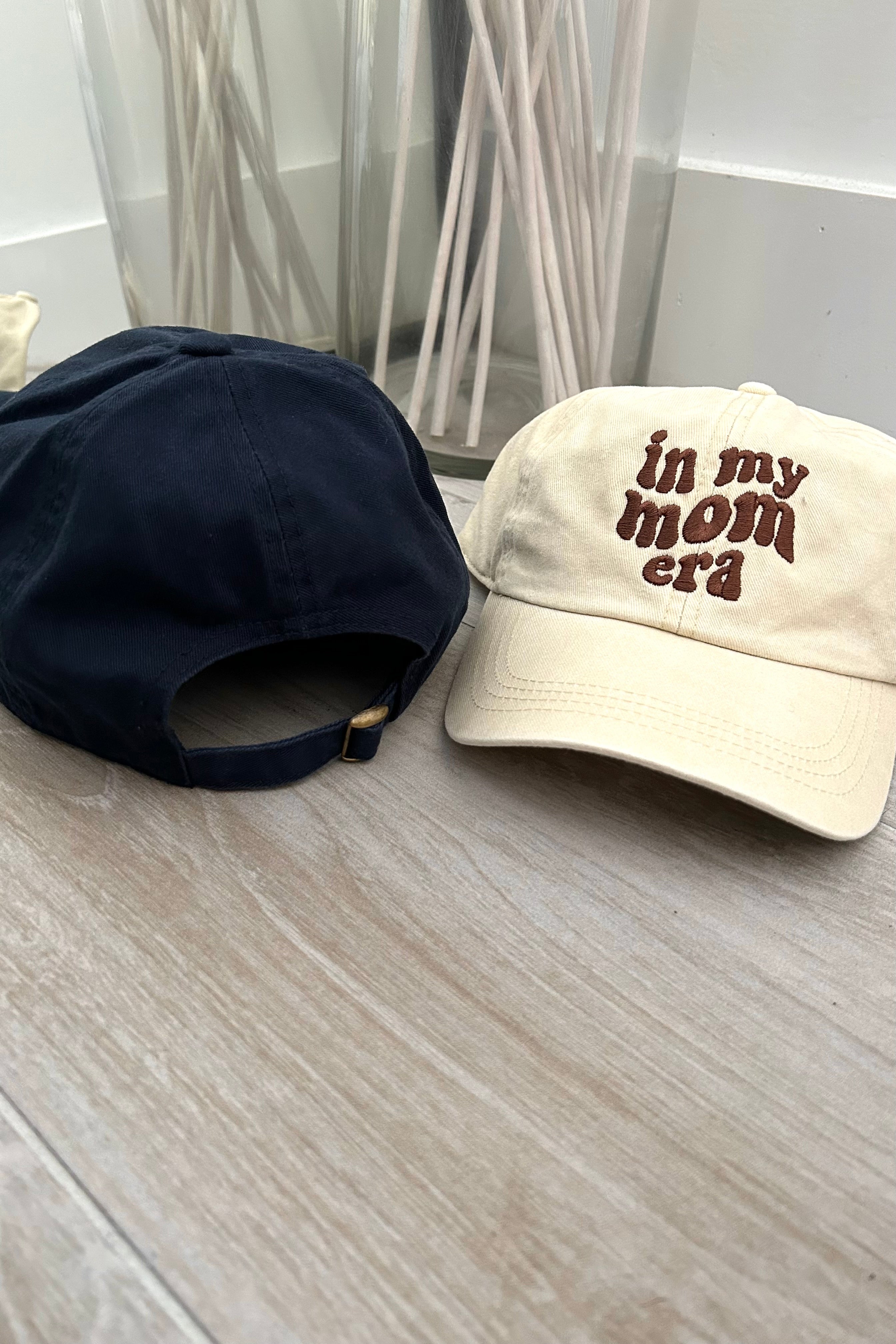 This trendy baseball cap is a must-have for any mom! With its Mom Era design available in both navy and khaki, this cap is the perfect accessory to show off your stylish and playful side. The adjustable strap ensures a perfect fit for all, making it a versatile addition to any wardrobe.