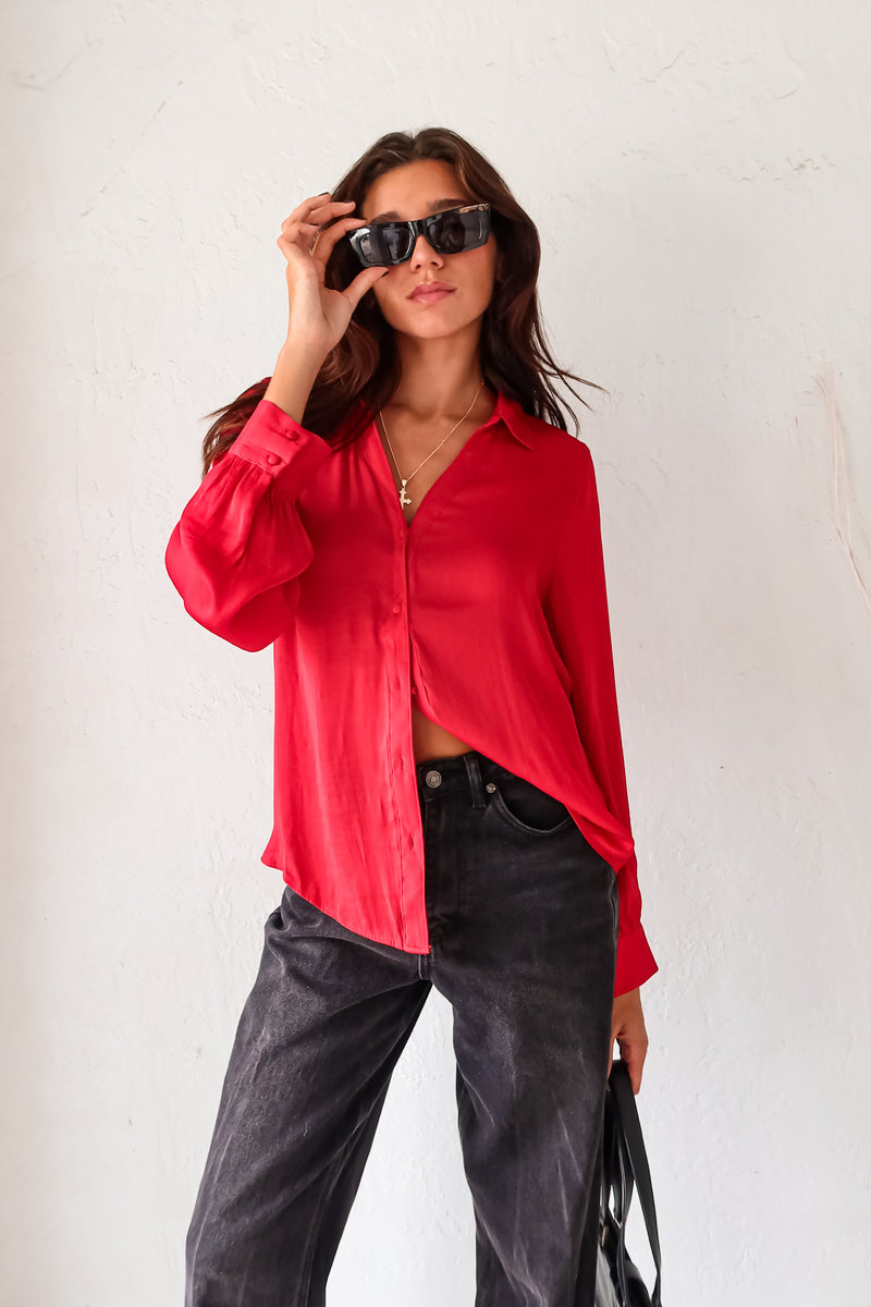 Put a playful twist on your classic work attire with our GABLES LONG SLEEVE BLOUSE. This red, non-lined button down blouse is both lightweight and comfortable for all-day wear. With long sleeves and button wrists, this blouse is perfect for any season. Don't settle for boring office wear, stand out in style!