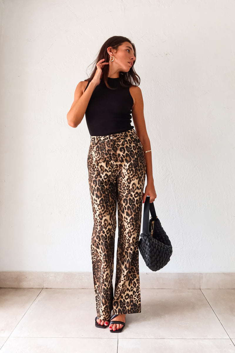 Unleash your wild side with our PROWL JEANS. These cheetah denim jeans feature a flattering wide leg and high waist for a fierce look. With a button zipper closure, front pockets, and belt loops, these jeans are both stylish and functional. Take a walk on the wild side!