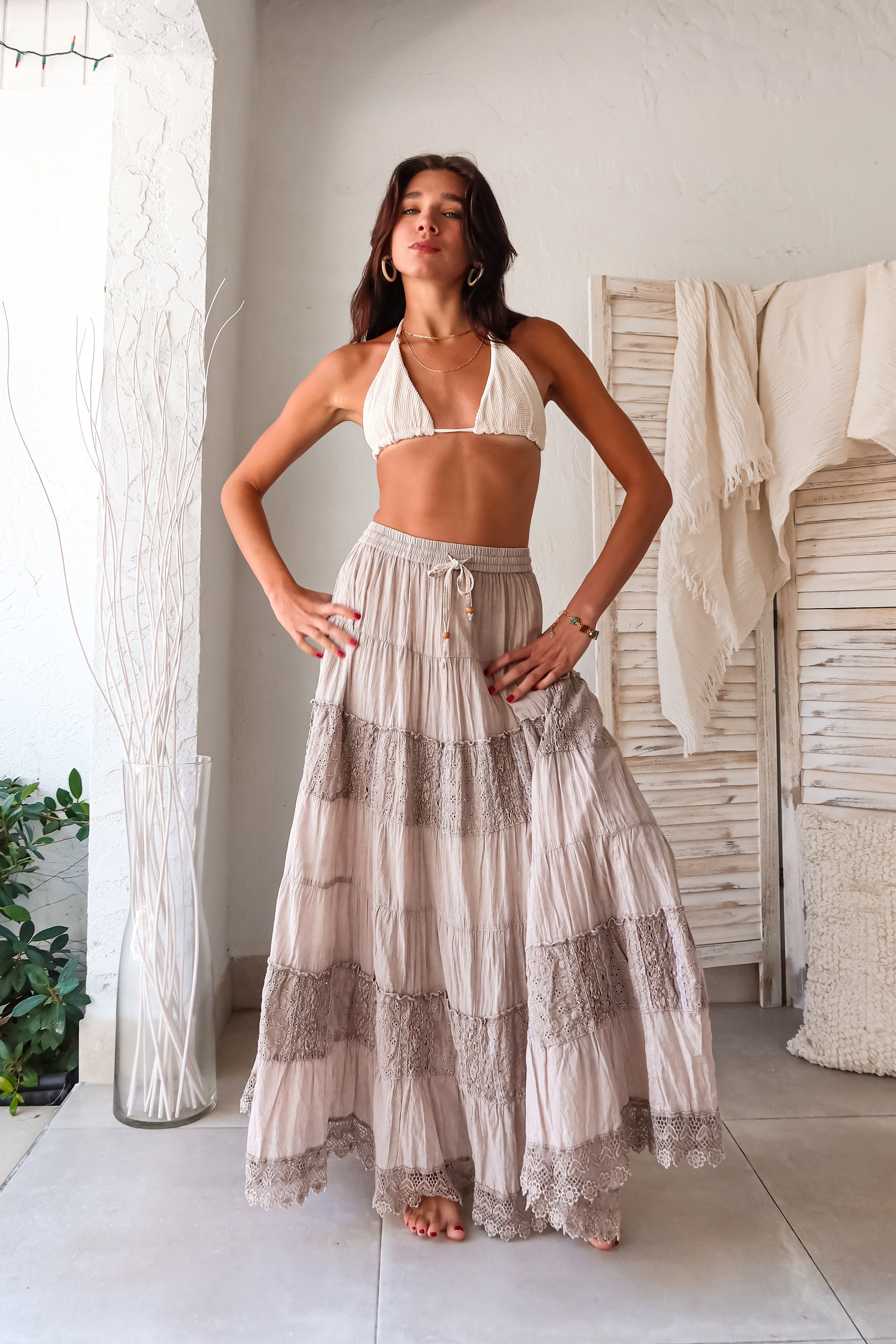 Get ready to shine with this CRINKLE LUREX STRING BIKINI SET! The gold shimmer adds a touch of glam while the adjustable sliding triangle top and Brazilian cut bottoms ensure a perfect fit. Tie around the neck and sides for added style, all while feeling comfortable and confident.