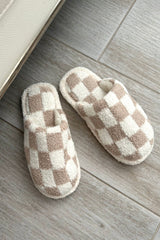 Step up your cozy game with our Checkmate Slippers! These white and khaki checker pattern slippers are not only stylish, but also made with comfy plush fabric for ultimate comfort. The cushioned sole will keep your feet happy all day long. It's game over for uncomfortable slippers!