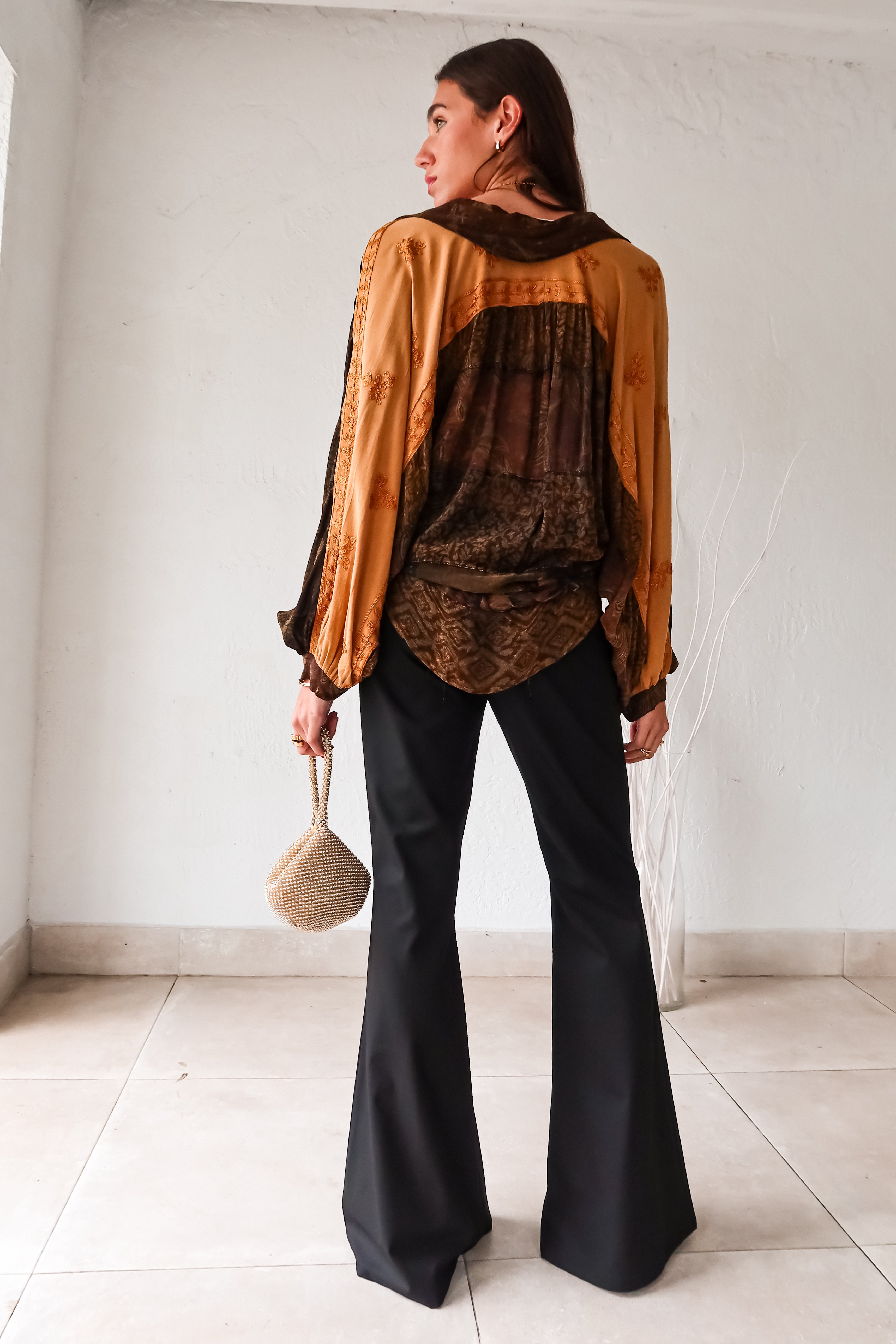 Rock your style in the playful Zeppelin Blouse in camel. This sheer chiffon shirt features a khaki/brown/tan collard design, front button down, and a convenient front left chest pocket. Versatile as a cover up, this blouse is perfect for effortless, fun fashion.