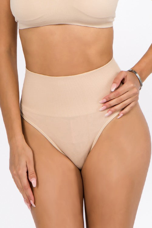 Get ready to say goodbye to uncomfortable and unflattering undergarments with our TUMMY CONTROL THONG! Made with a high waist fit and ribbed top, this thong will smooth your tummy and provide a comfortable fit all day long. Available in two sizes, made with Nylon/Spandex for ultimate stretch and support. Say hello to a confident silhouette with our TUMMY CONTROL THONG!