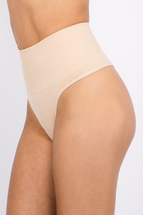 Get ready to say goodbye to uncomfortable and unflattering undergarments with our TUMMY CONTROL THONG! Made with a high waist fit and ribbed top, this thong will smooth your tummy and provide a comfortable fit all day long. Available in two sizes, made with Nylon/Spandex for ultimate stretch and support. Say hello to a confident silhouette with our TUMMY CONTROL THONG!