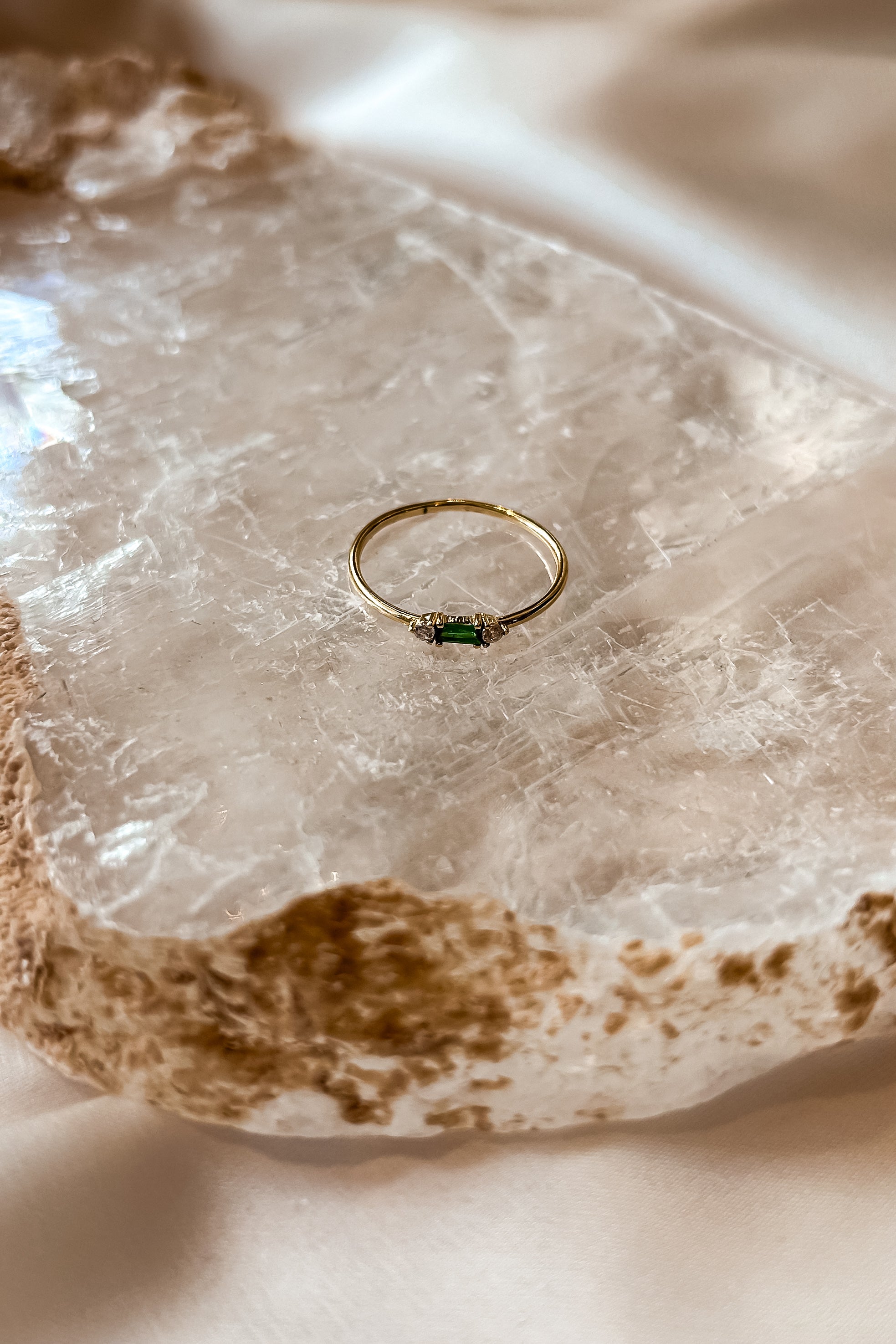 Add a touch of sparkle to your ensemble with our Vermeil Emerald Ring. This playful piece features a gold-plated 925 sterling silver band and a stunning emerald gemstone. Its tarnish resistant design ensures long-lasting wear. Sized for a perfect fit.