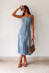 Get ready to rock a laid-back look with our Cypress Denim Midi Dress. This versatile piece features a front button down closure and adjustable shoulder straps for a customizable fit. The stretchy fabric and smocked backing provide ultimate comfort, while the chest stitch detail adds a touch of unique style. Non lined for a lightweight feel.