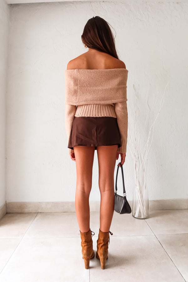 The VESPER MINI SKIRT in brown is the perfect mix of style and comfort. The overlap front detail adds a touch of flair, while the back zipper closure makes it easy to slip on and off. With shorts underneath and stretchy fabric, this mini skirt is both practical and flattering.