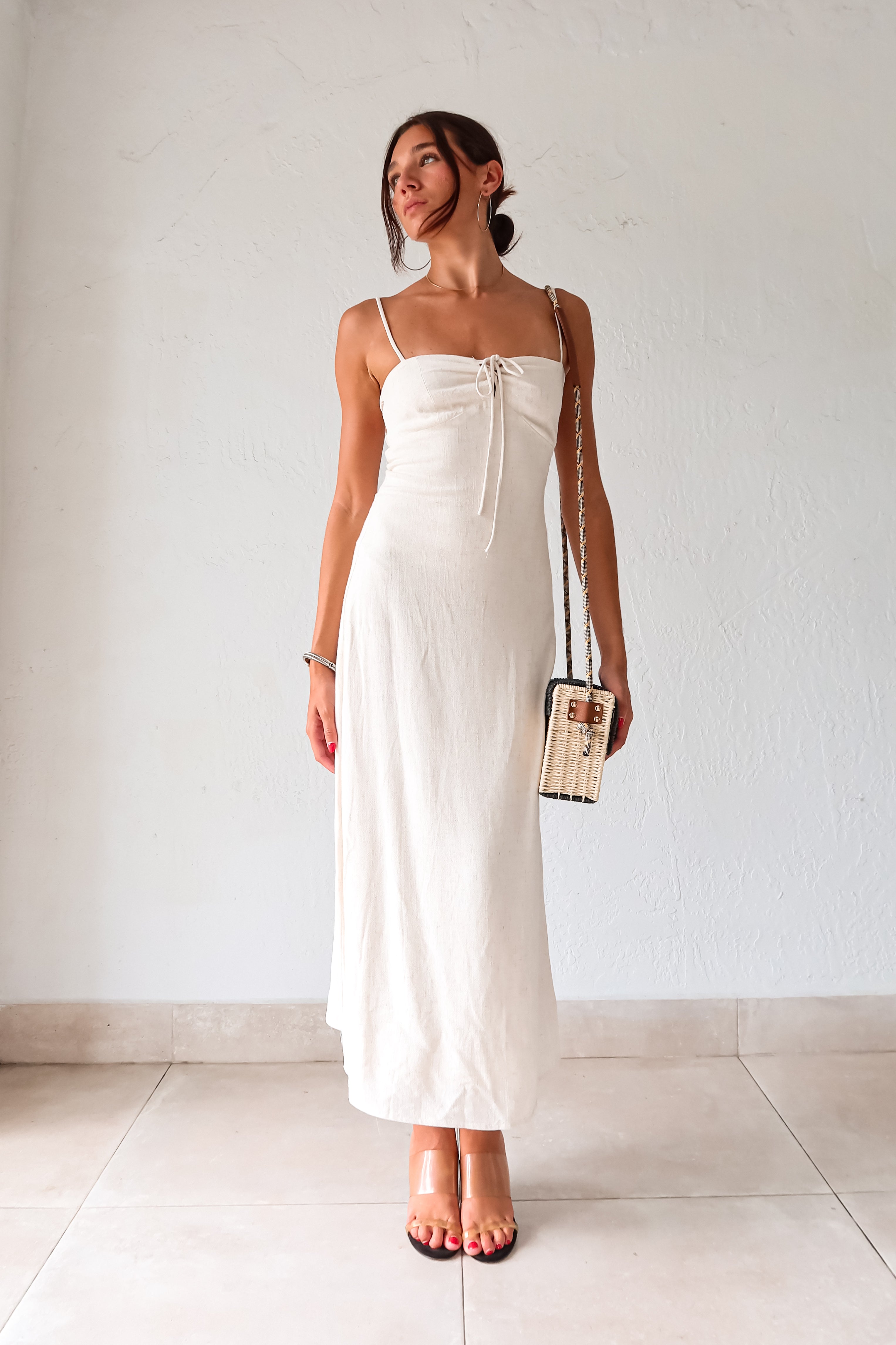 Add a touch of beachy glam with our Positano Bag. The beige and black squared handbag features a gold starfish detail and a unique rope design shoulder strap. Perfectly paired with our Melrose Linen Maxi dress. Snap buckle closure adds convenience and style.