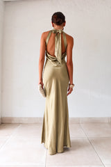 Take your style to the next level with the MAIN EVENT SATIN MAXI DRESS! This luxurious dress features a high neckline and adjustable tie in the back, perfect for creating a flattering silhouette. The draped back adds a touch of elegance to complete your look. Dress to impress with this stunning piece.