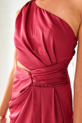 Indulge in the wine red NAPA VALLEY SATIN MAXI DRESS - a playful twist on a classic silhouette. The asymmetrical design features a right torso slit and left leg slit, while the side zipper closure adds a touch of convenience. Effortlessly chic and undeniably unique, this dress is perfect for any occasion.