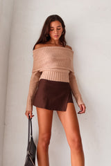 Stay cozy and stylish all season long with our Aspen Sweater! This tan long sleeve sweater features a unique foldover design, ribbed wrist and torso for a snug fit, and stretchy fabric for ultimate comfort. Perfect for any occasion, whether you're out and about or lounging at home.