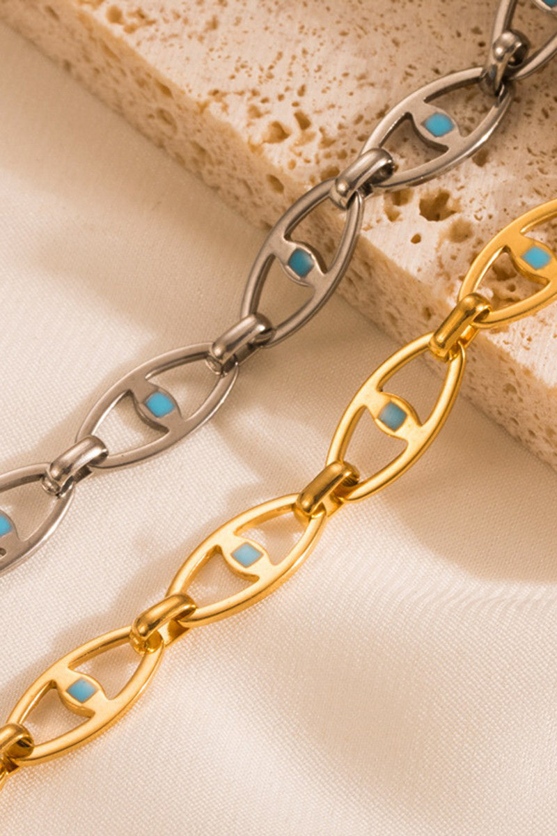 Make a statement with our SS HOLLOW EYE BRACELET - GOLD. This stainless steel bracelet features an evil eye design that is both eye-catching and protective. With tarnish resistant and hypoallergenic properties, this bracelet is perfect for those with sensitive skin. So be bold and stylish without any worries!