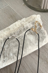 Add some attitude to your outfit with the Melrose Necklace. Featuring a rope design and your choice of a gold or silver charm, this necklace is a perfect statement piece. Plus, with a back clasp closure and tarnish-resistant, hypoallergenic materials, you can rock this necklace confidently and comfortably.