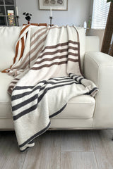 Stay cozy and stylish with our Striped Microfiber Blanket! Made of 100% polyester microfiber, this white blanket with navy, khaki, and brown stripes is perfect for snuggling up on chilly nights. Measures 50x60 inches. Upgrade your comfort game now!