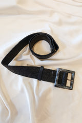 Unleash your style with our Marbled Stretch Belt! This black woven belt features a unique grey and black marble buckle and stretchy fabric for a comfortable fit. One size fits all for endless possibilities. Upgrade your wardrobe today!