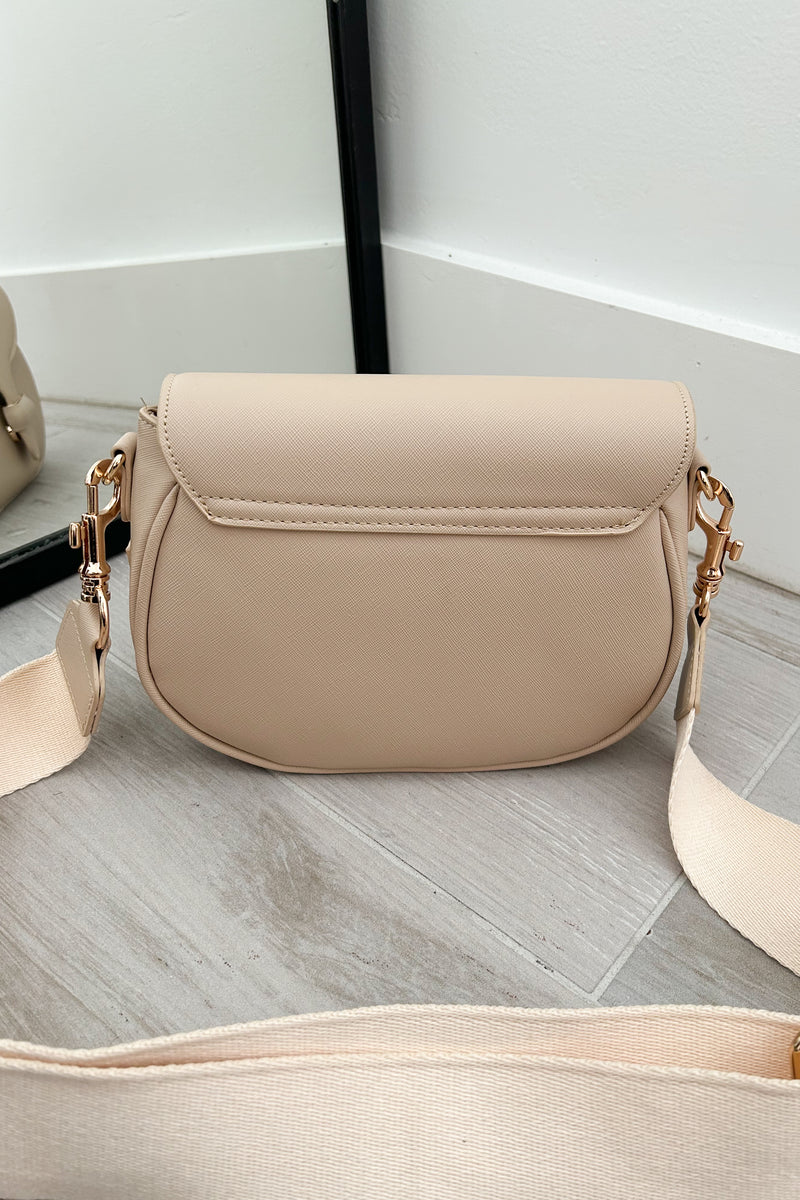 Sling in style with our GRETA TEXTURE CROSSBODY BAG. Made from vegan leather, it features a removable crossbody strap and gold buckle detail. Stay on trend with magnetic and zipper closures. Your perfect carry-all, minus the guilt!