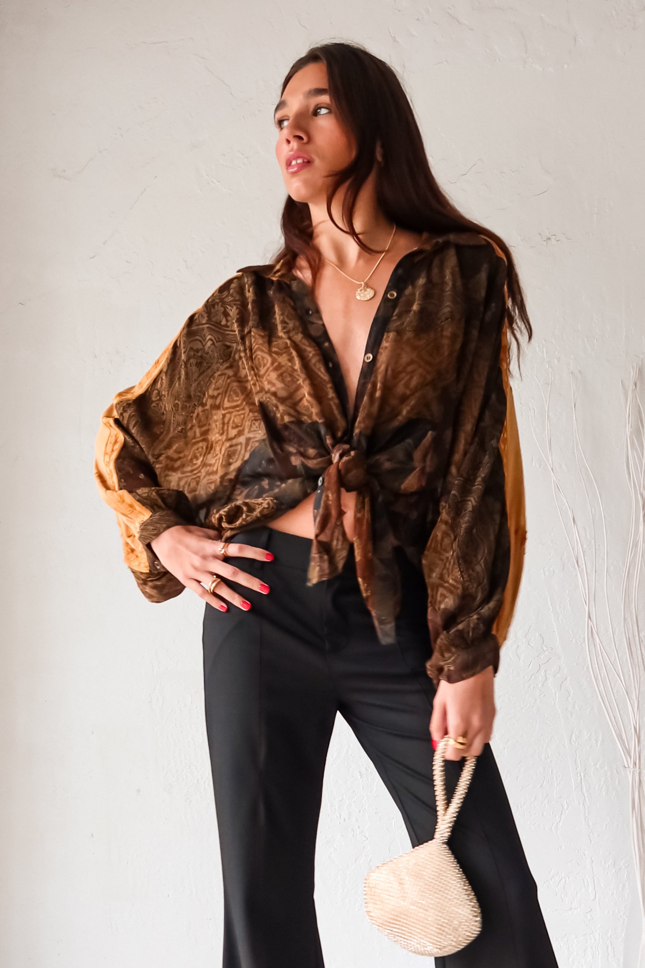 Rock your style in the playful Zeppelin Blouse in camel. This sheer chiffon shirt features a khaki/brown/tan collard design, front button down, and a convenient front left chest pocket. Versatile as a cover up, this blouse is perfect for effortless, fun fashion.