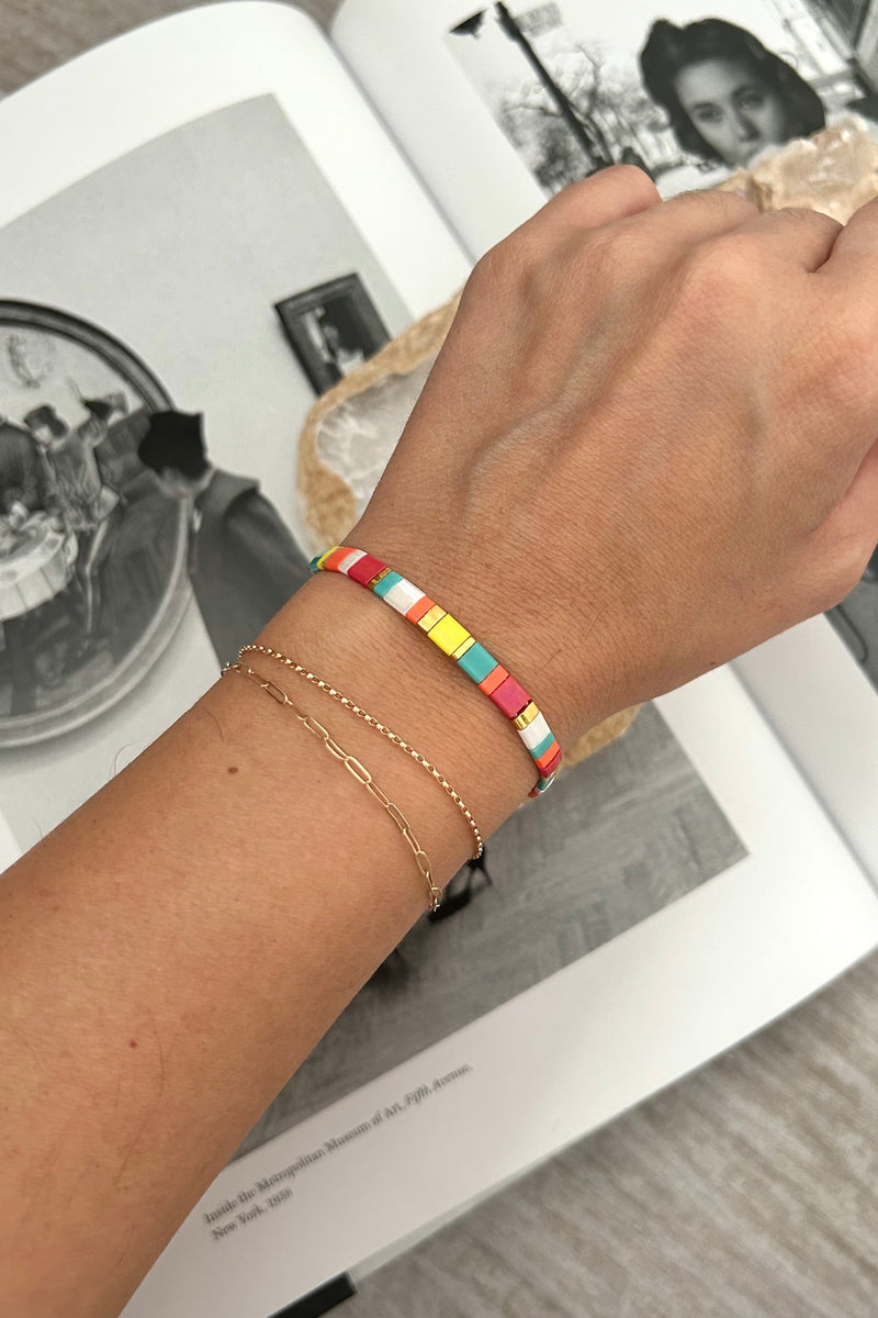 Brighten up any outfit with this playful SD Multi Bracelet! Featuring multi-colored charm rope and boasting tarnish resistance and hypoallergenic properties, this bracelet is perfect for adding a pop of color and style to your look without the worry of discoloration or irritation. Your wrist will thank you!