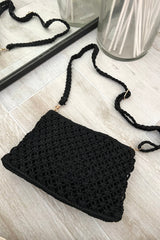 This black knit handbag adds a touch of boho-chic to any outfit. The acrylic gold hand strap and removable straps offer versatility, while the zipper closure keeps your belongings secure. Measuring 11 inches in length, 7 inches in height, and 1 inch in width, it's the perfect size for all your essentials.