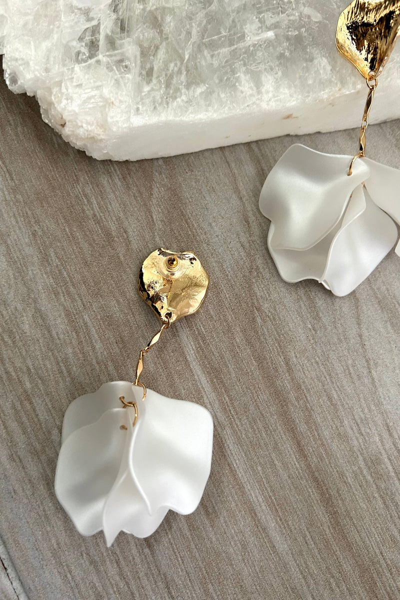 Add some whimsy to your jewelry collection with our ORCHID EARRING. These Gold and White acrylic floral earrings are not only tarnish resistant and hypoallergenic, but also perfect for everyday wear. Embrace your inner flower child with these unique and playful earrings.